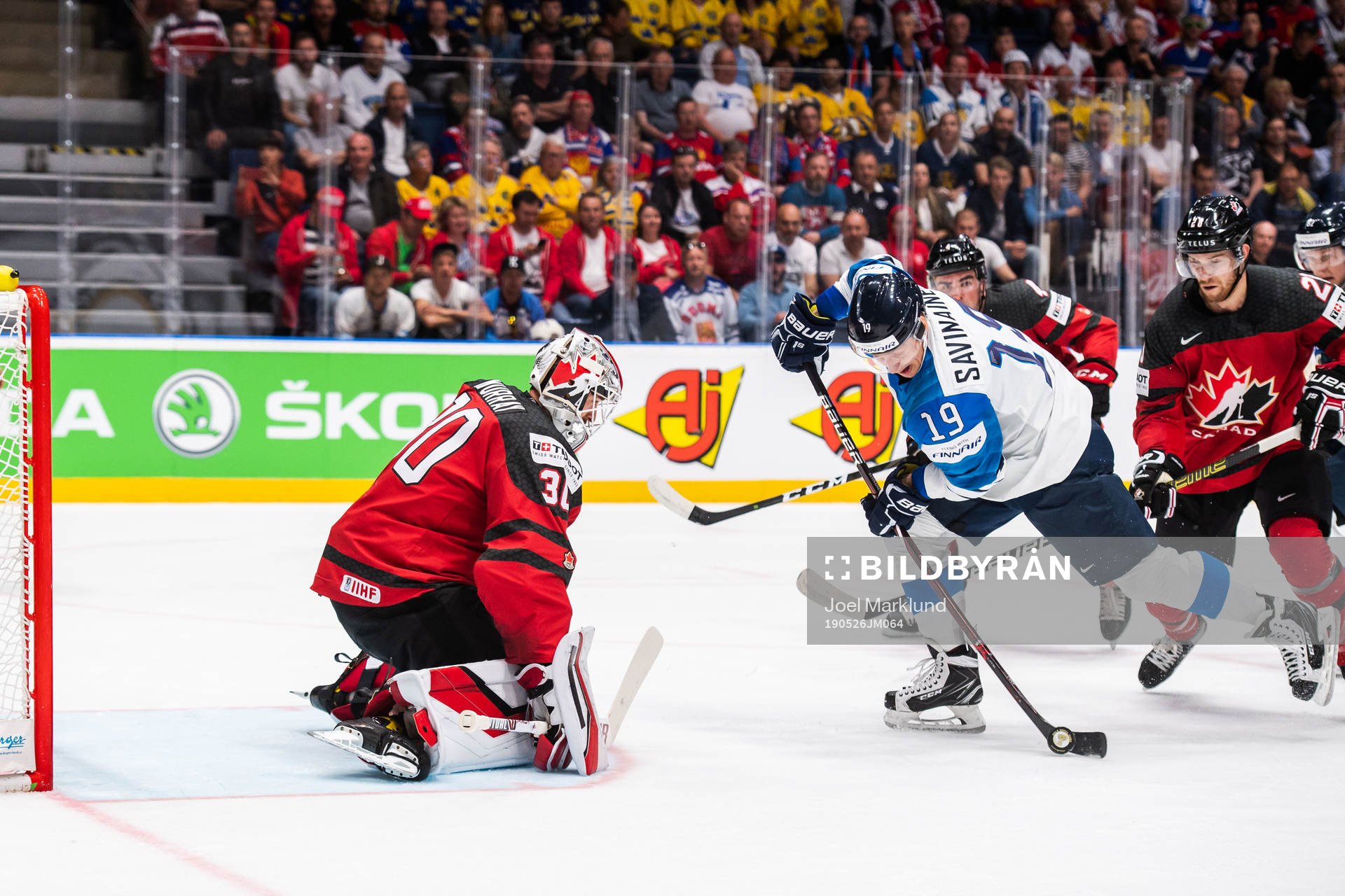 Veli-Matti Savinainen of Finland and goaltender Matt Murray