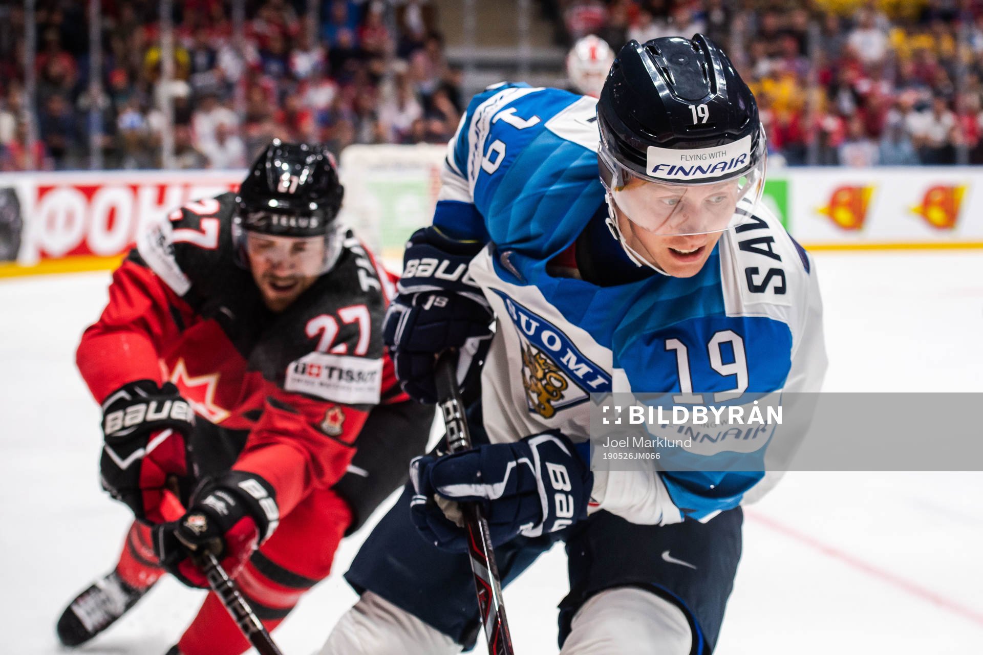 Shea Theodore of Canada and Veli-Matti Savinainen of Finland