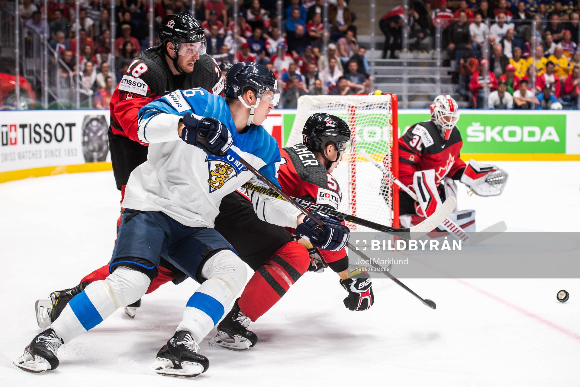 Jere Sallinen of Finland against Pierre-Luc Dubois and Troy