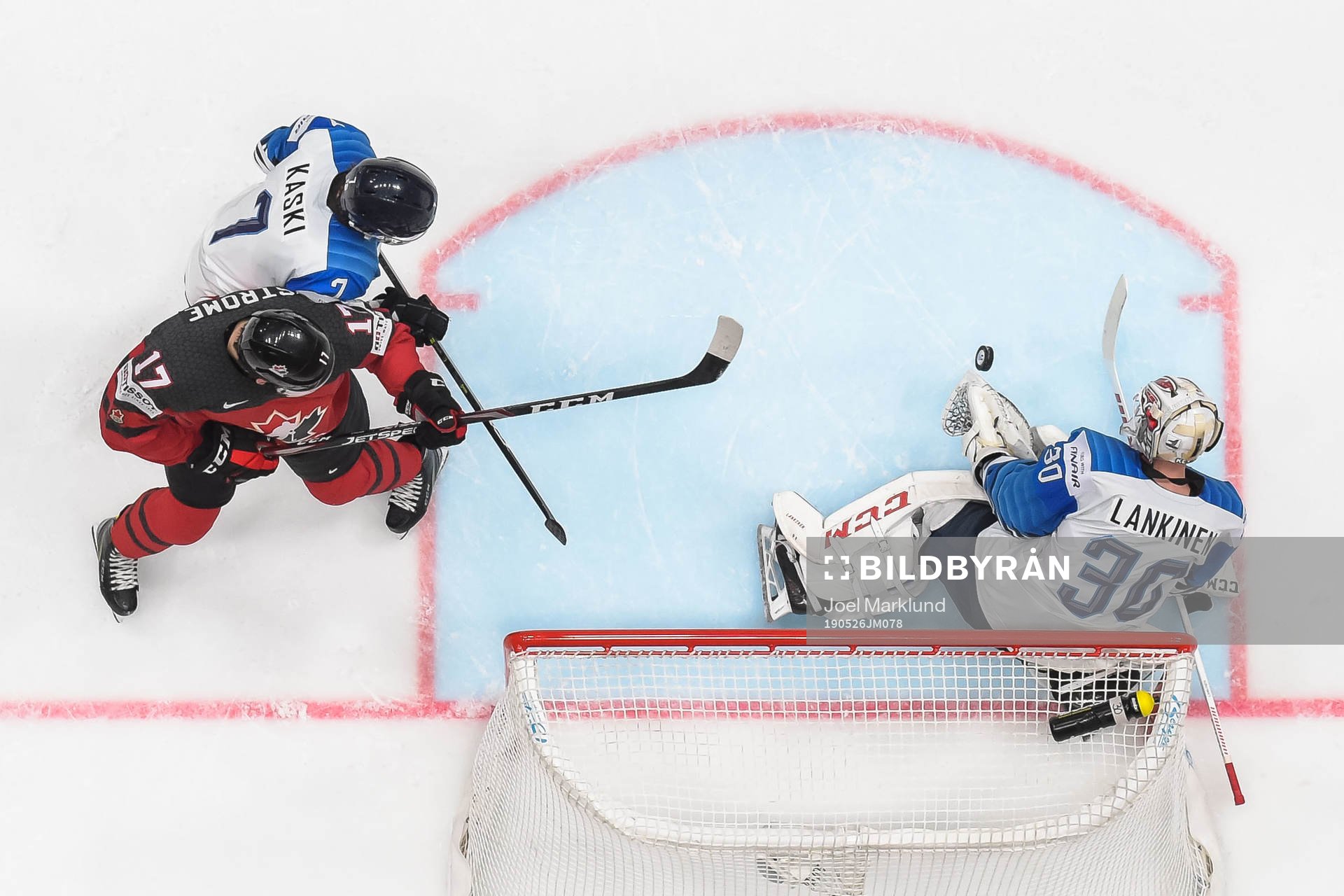 Dylan Strome of Canada against Oliwer Kaski and goaltender