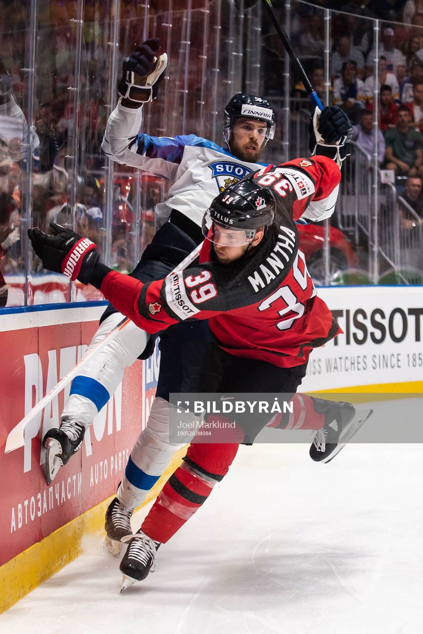 Jani Hakanpää of Finland and Anthony Mantha of Canada