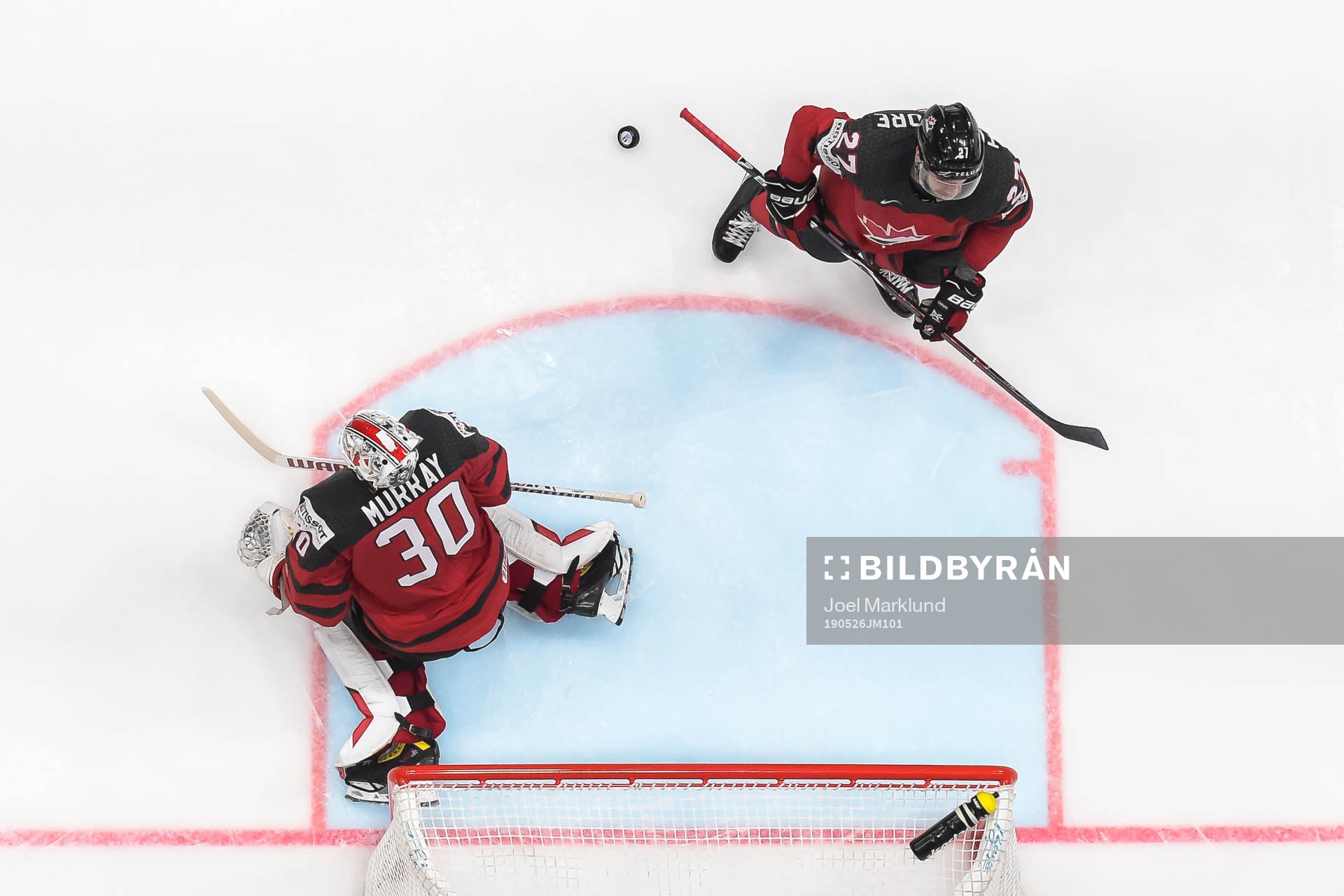 Goaltender Matt Murray and Shea Theodore of Canada look