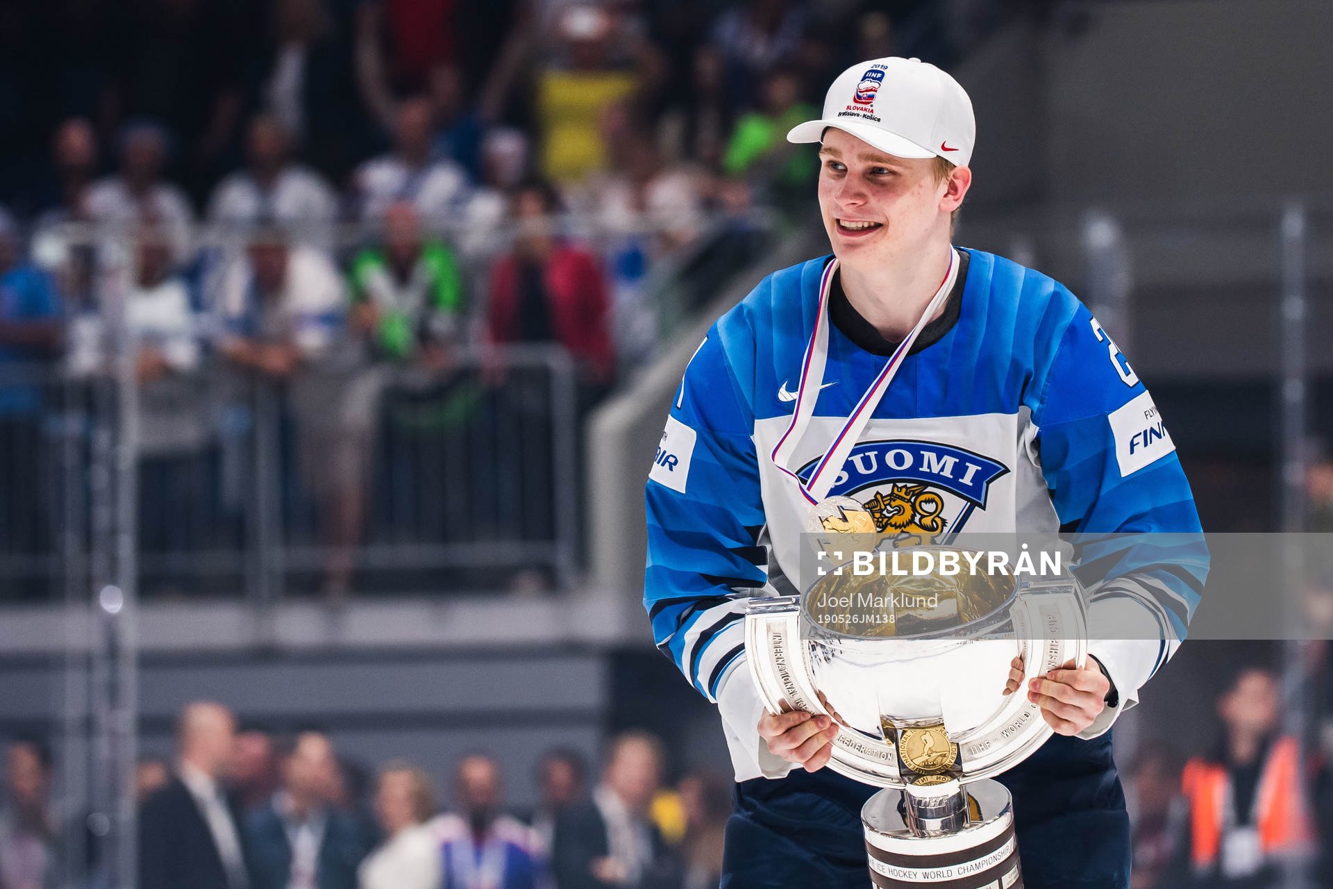 Kaapo Kakko of Finland celebrates with the trophy