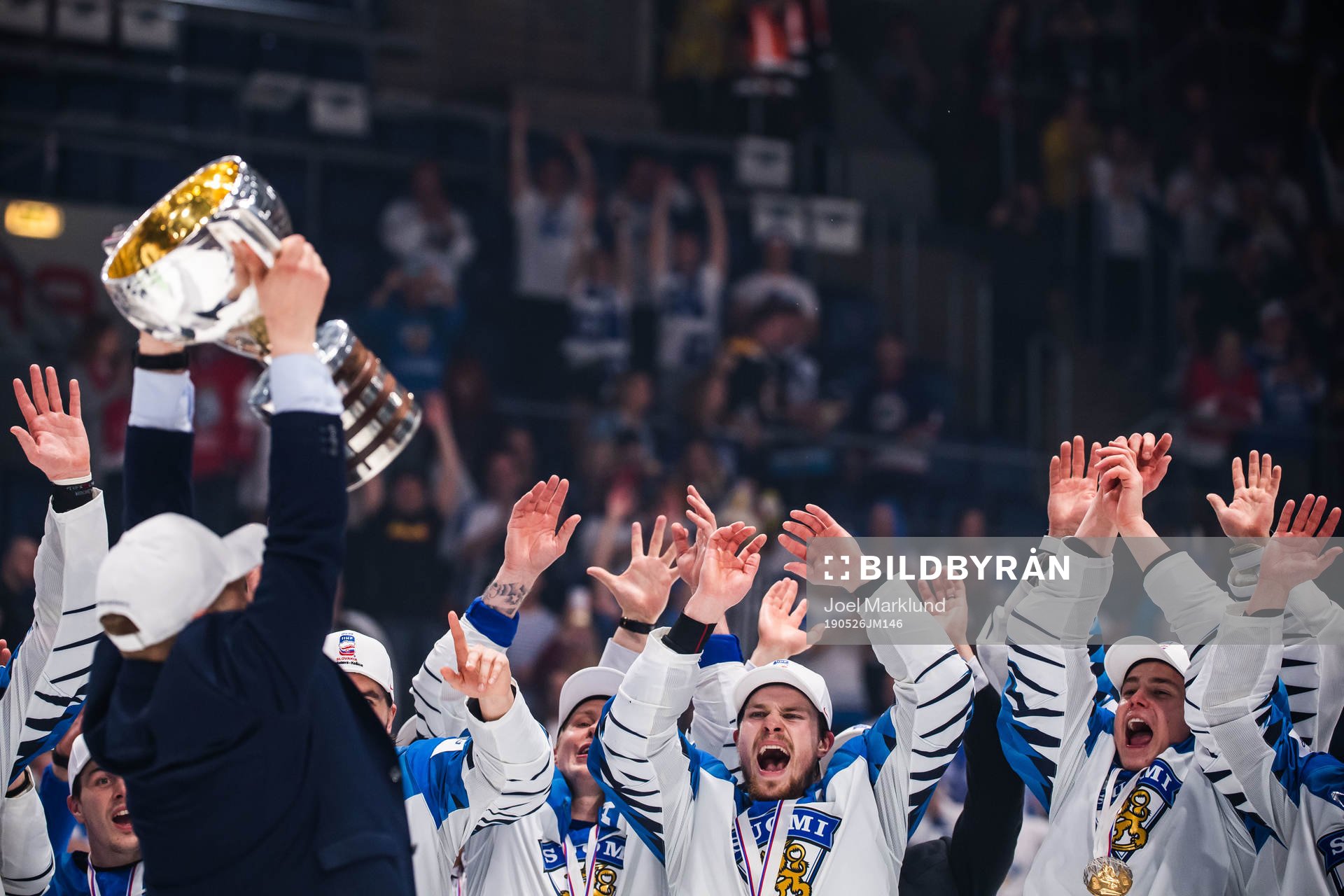 Players of Finland celebrates with the trophy