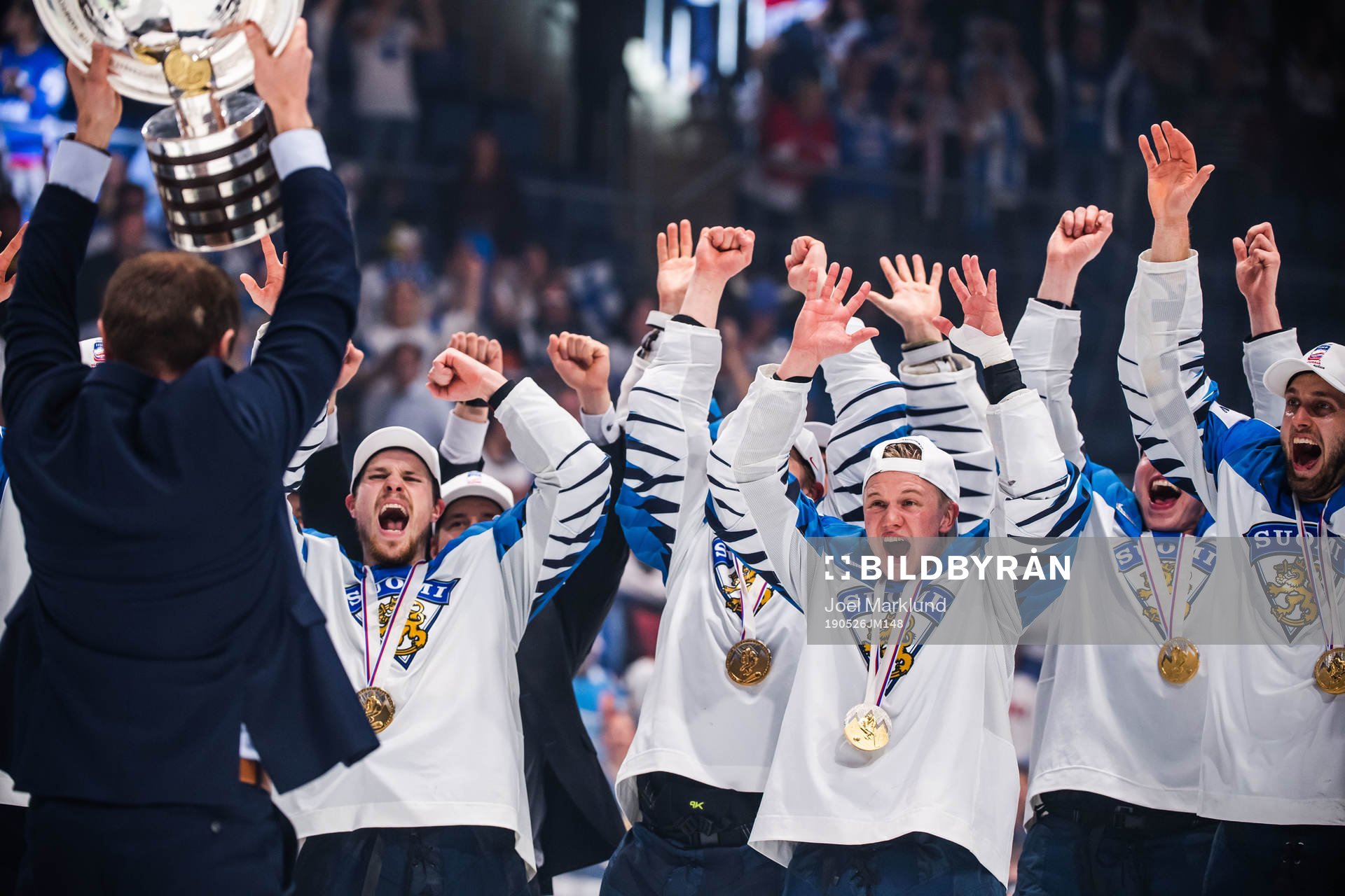 Players of Finland celebrates with the trophy