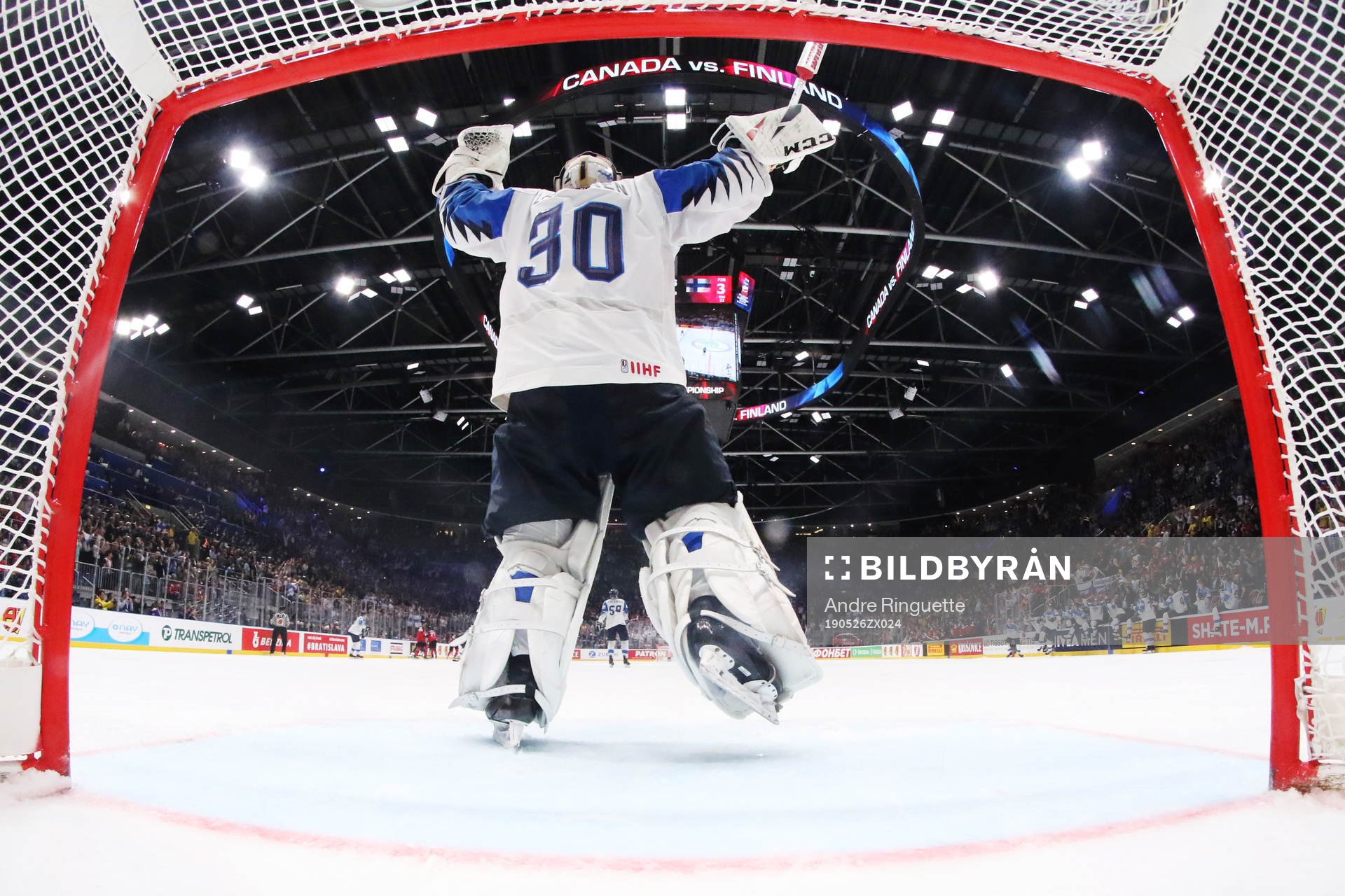 Goaltender Kevin Lankinen of Finland celebrates his team's