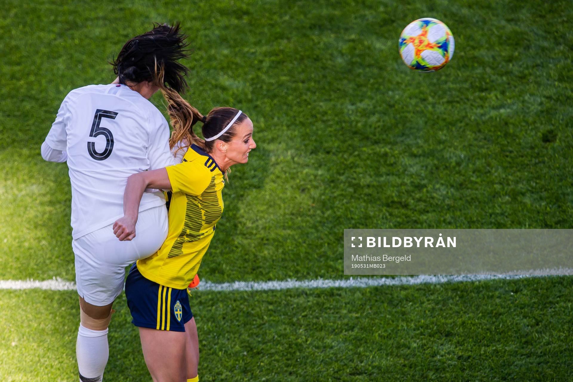 Doyeon Kim of South Korea and Kosovare Asllani of Sweden