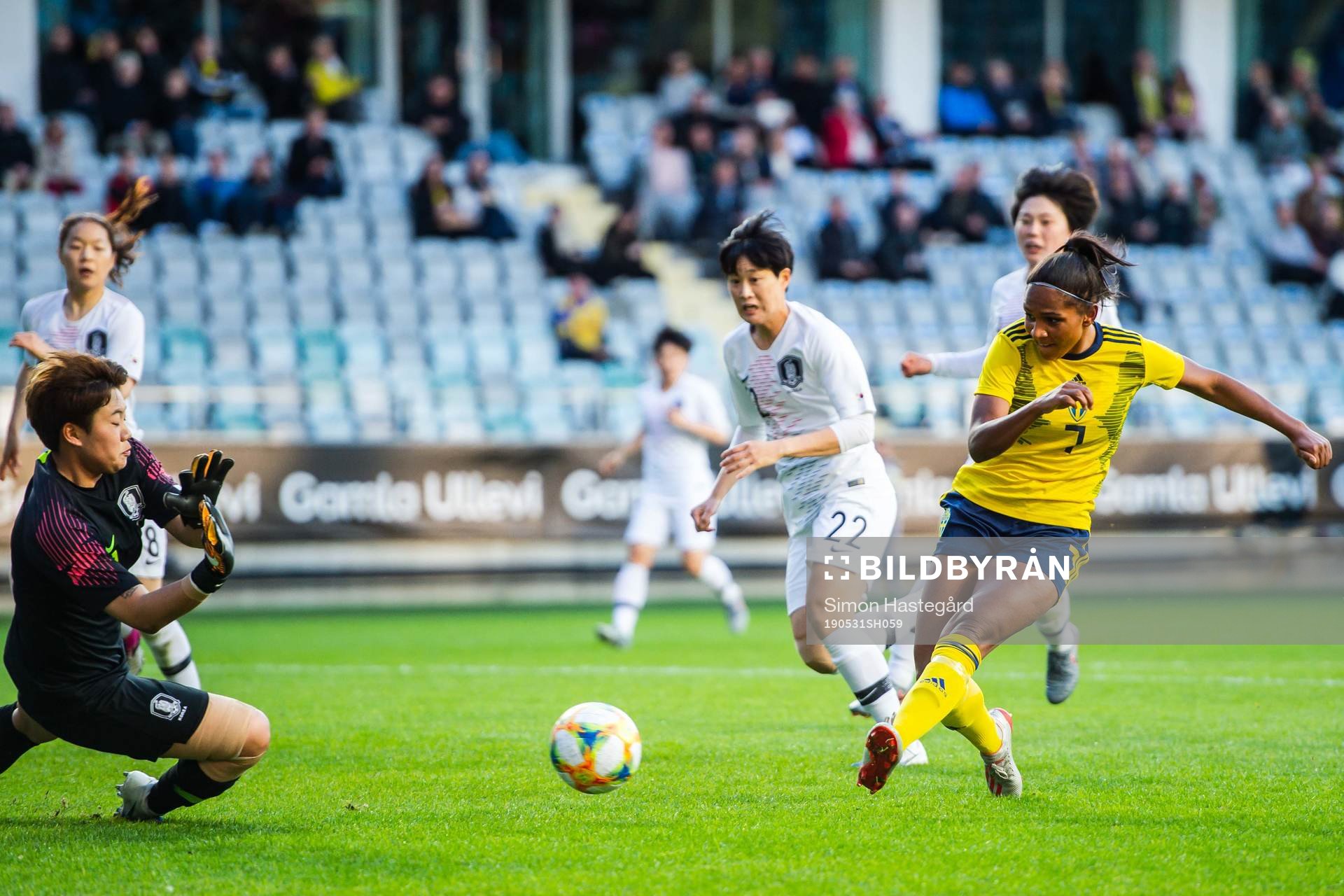 Madelen Janogy of Sweden scores 1-0 behind goalkeeper Gaae