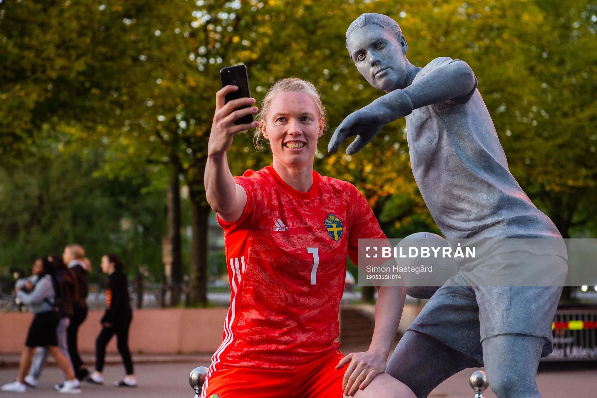 Goalkeeper Hedvig Lindahl of Sweden next to a statue of