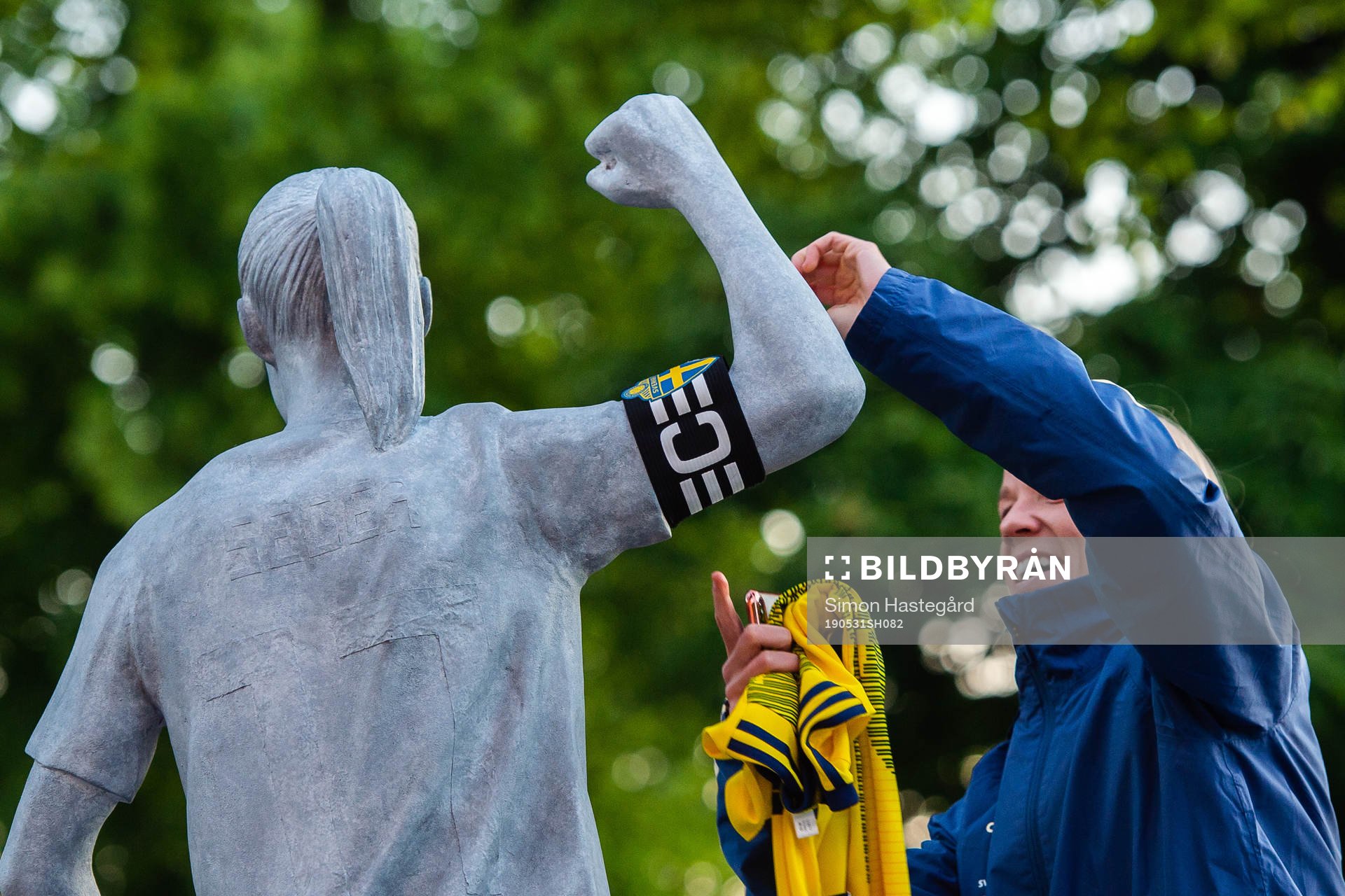 Caroline Seger of Sweden removes the captain's armband of