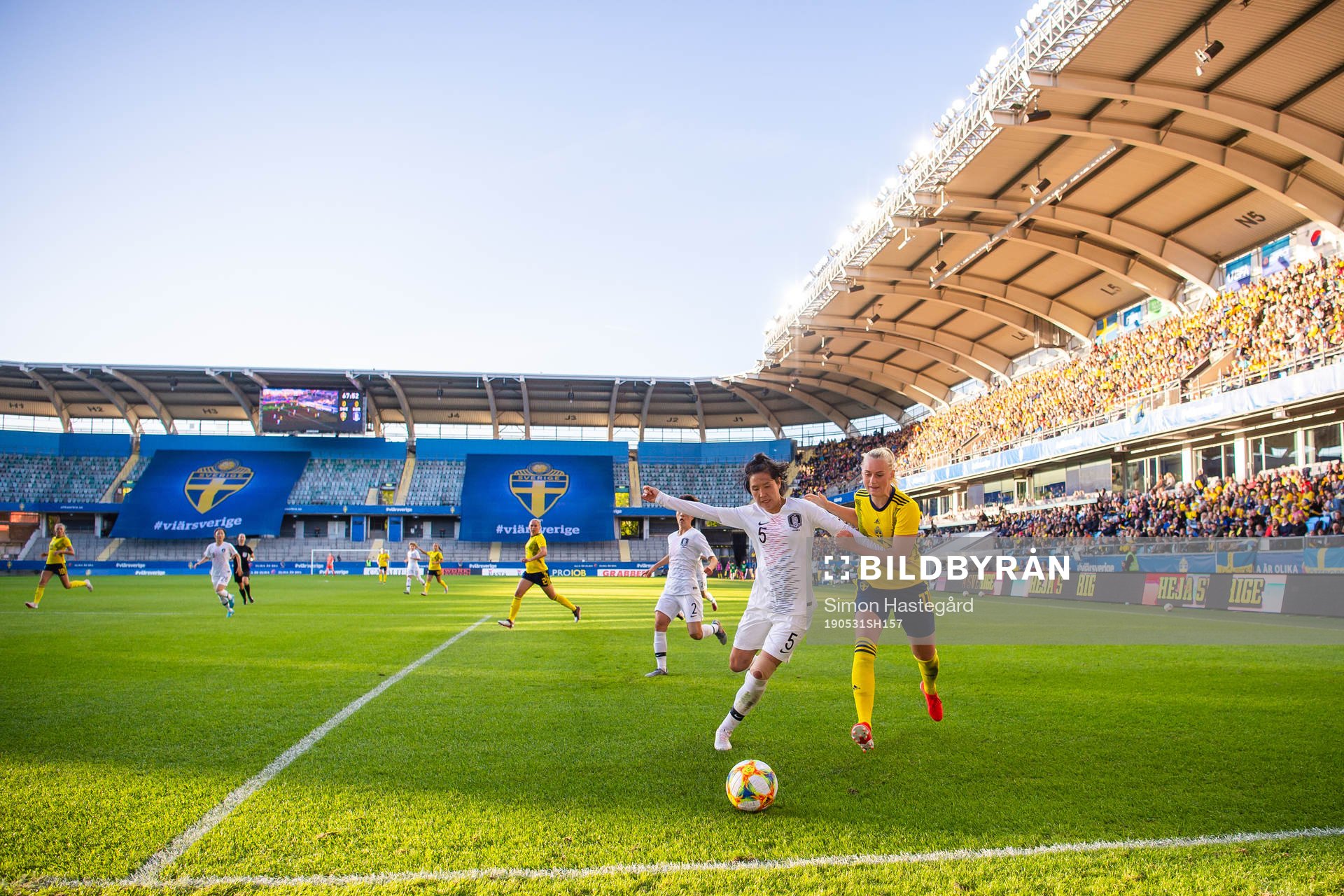 Doyeon Kim of South Korea   and Stina Blackstenius of Sweden