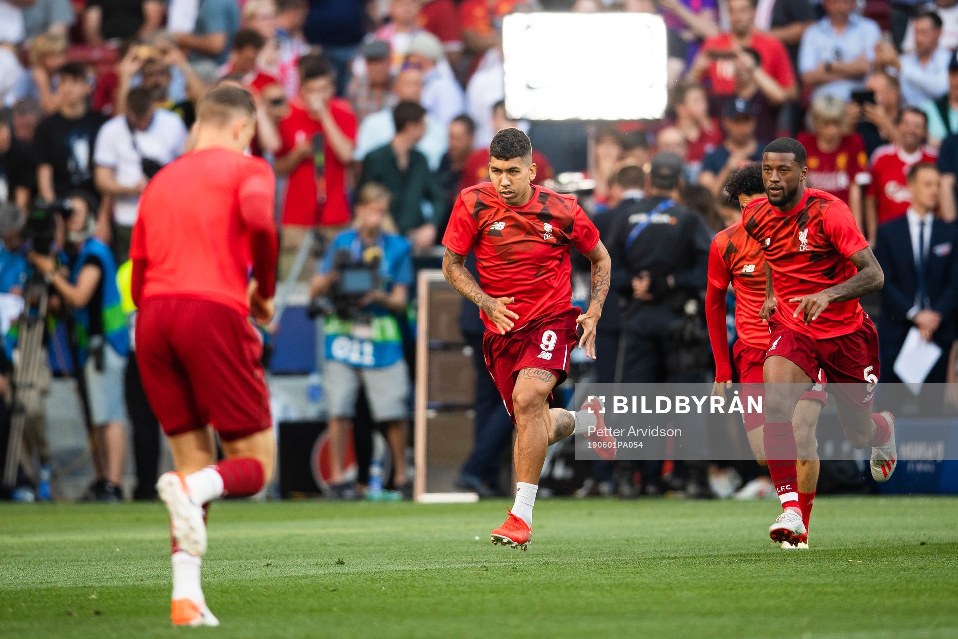 Roberto Firmino and Georginio Wijnaldum of Liverpool