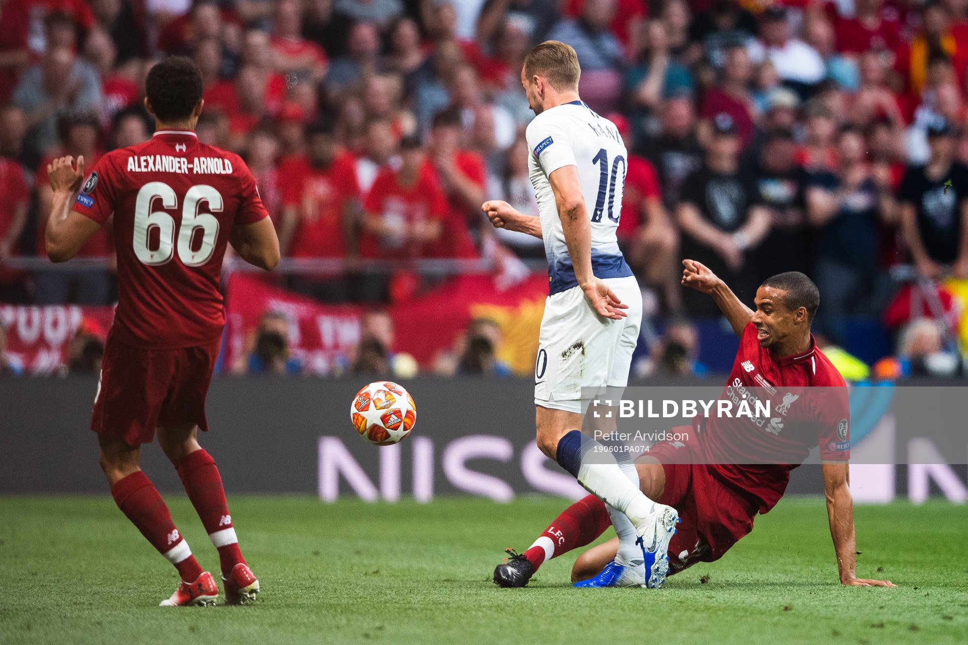 Harry Kane of Tottenham and Joel Matip of Liverpool