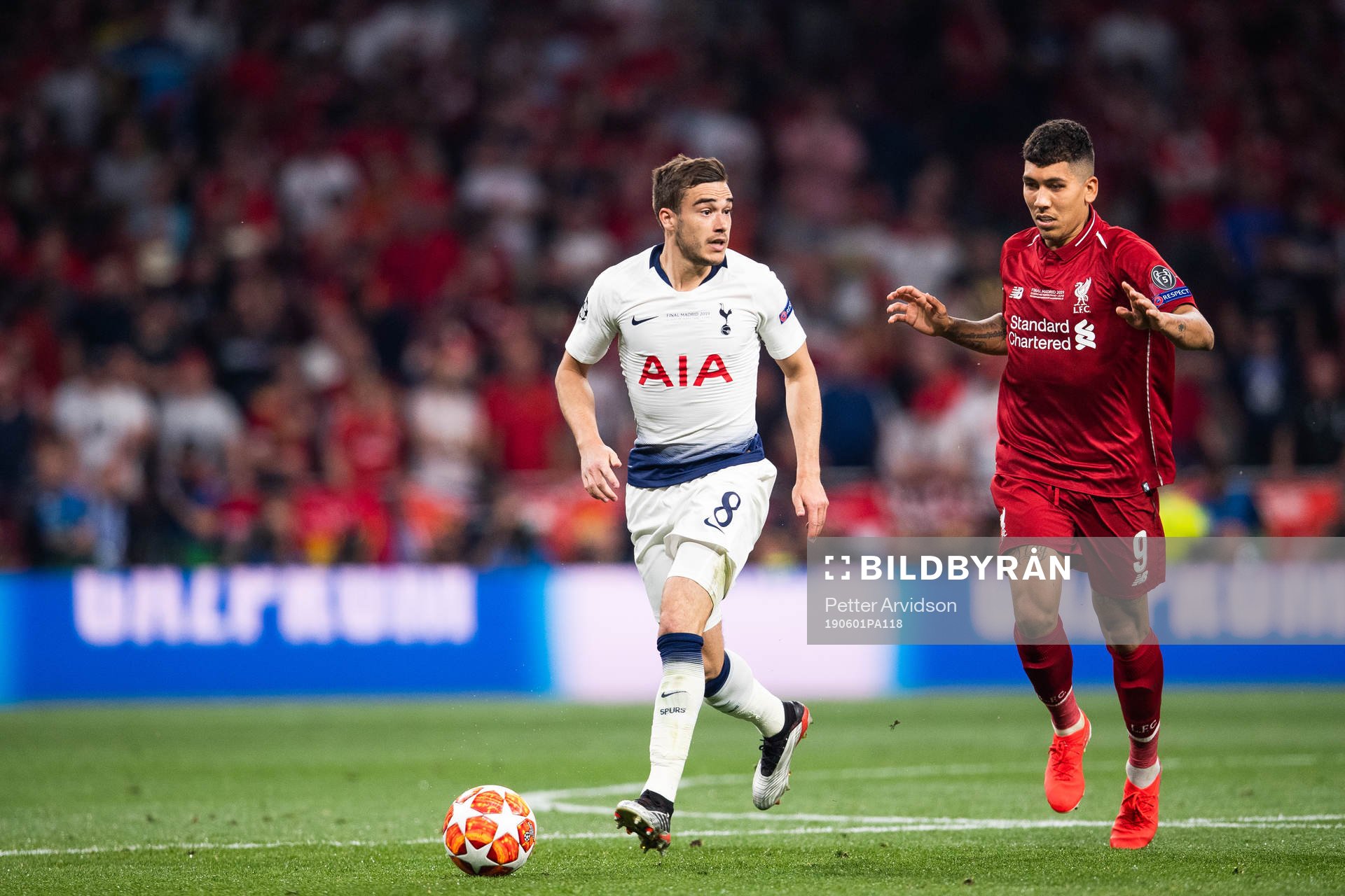 Harry Winks of Tottenham and Roberto Firmino of Liverpool