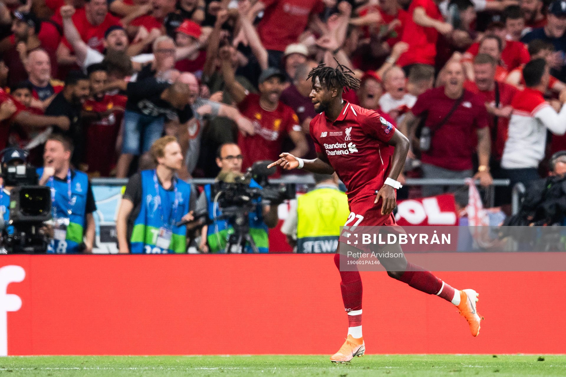Divock Origi of Liverpool celebrates scoring 0-2