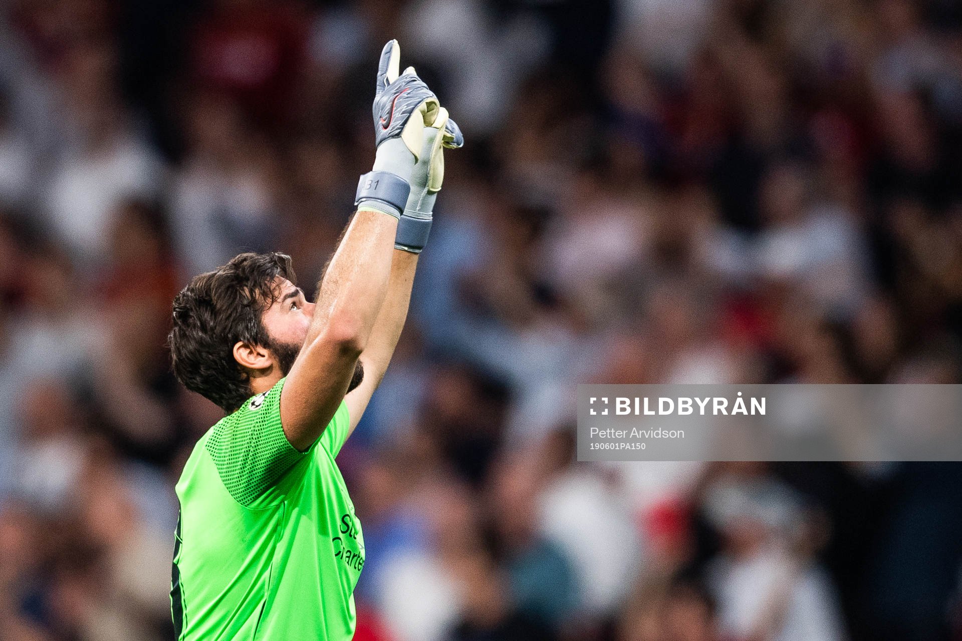 Goalkeeper Alisson Becker of Liverpool celebrates