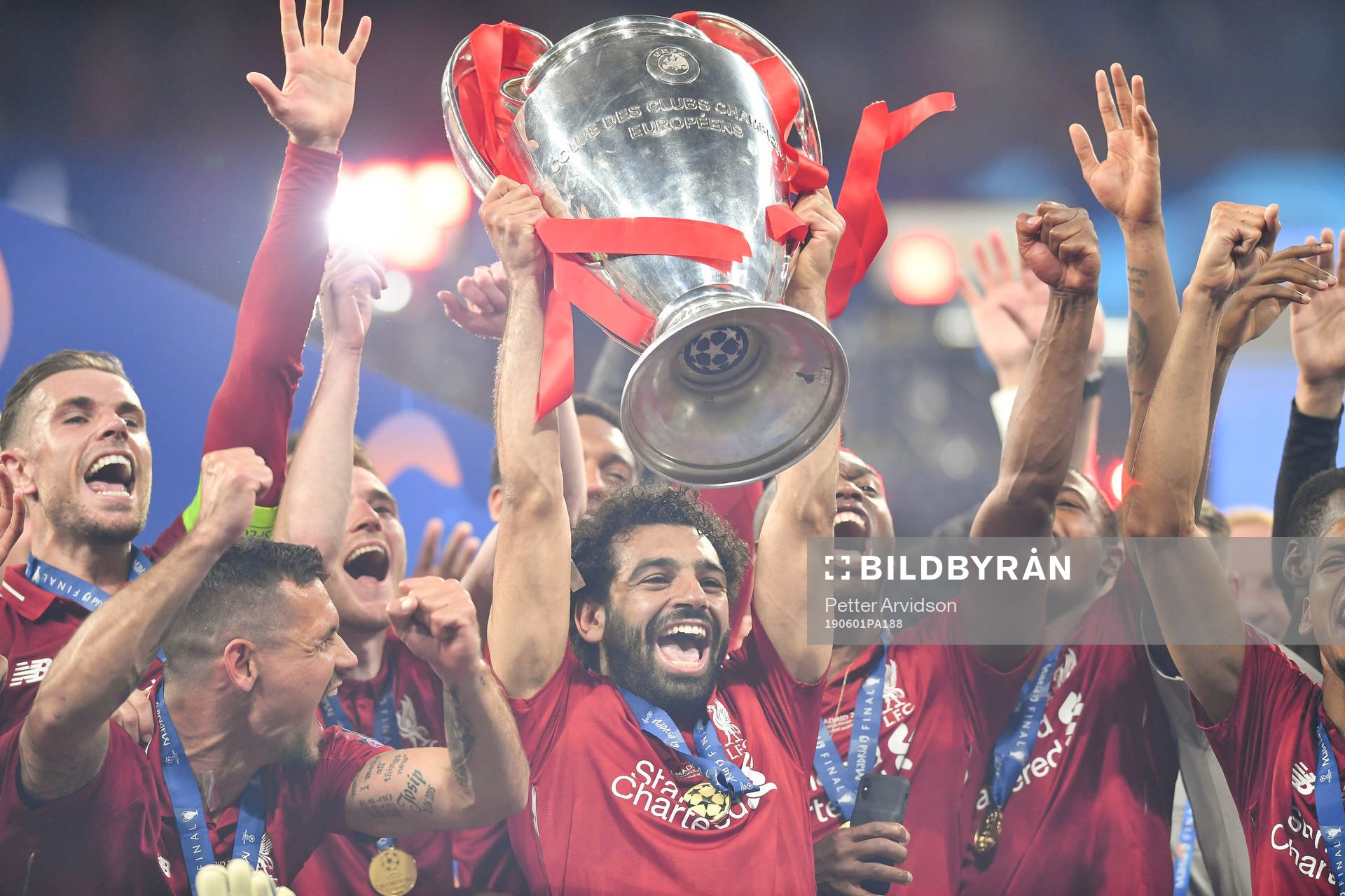 Mohamed Salah of Liverpool raises the throphy in front of
