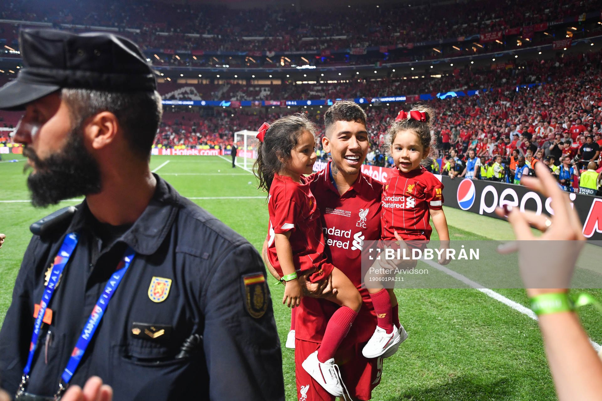 Roberto Firmino of Liverpool celebrates with his children