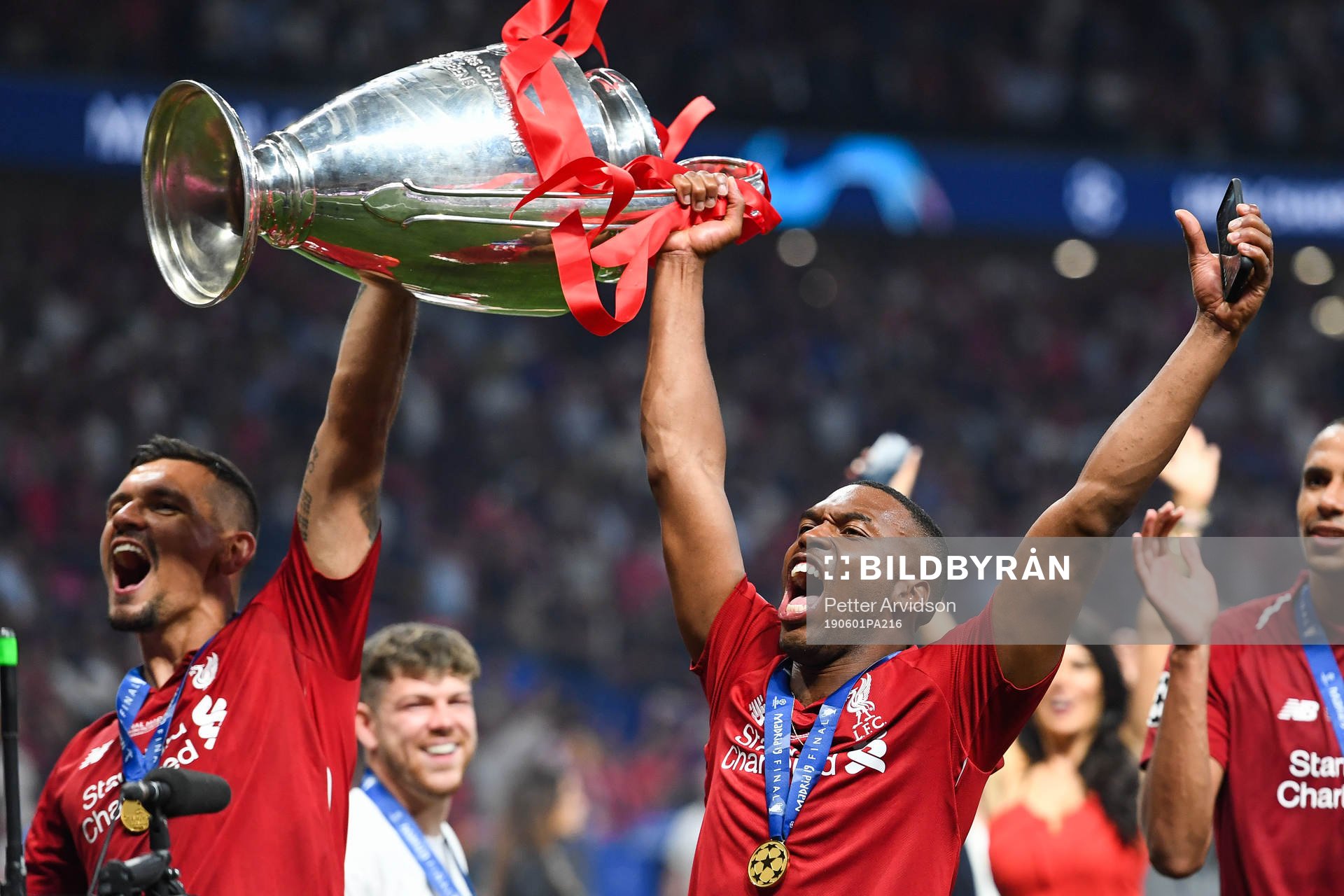 Daniel Sturridge of Liverpool celebrates with the trophy