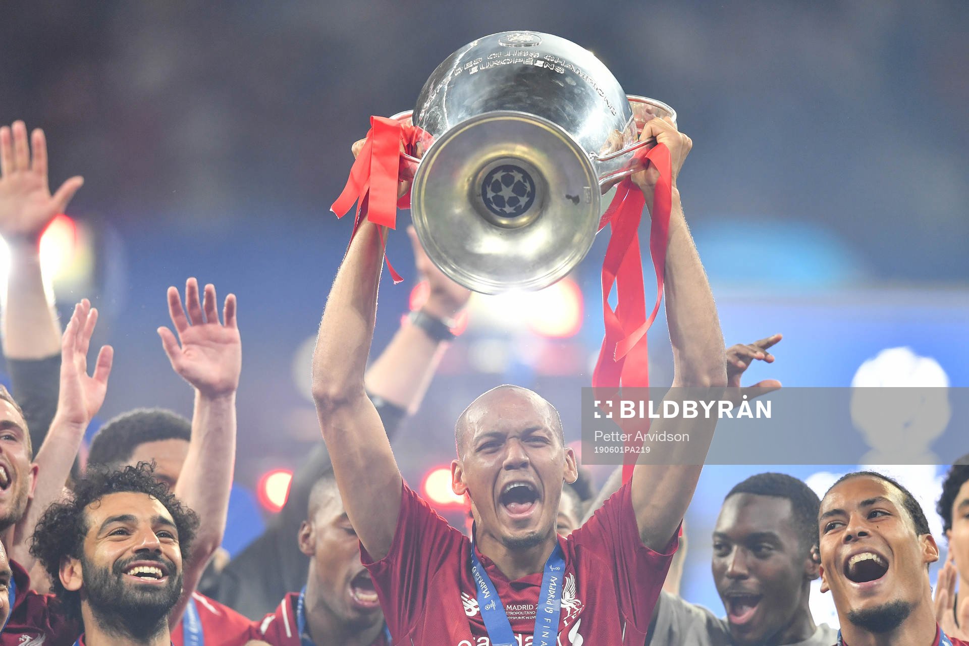 Fabinho of Liverpool celebrate with the trophy