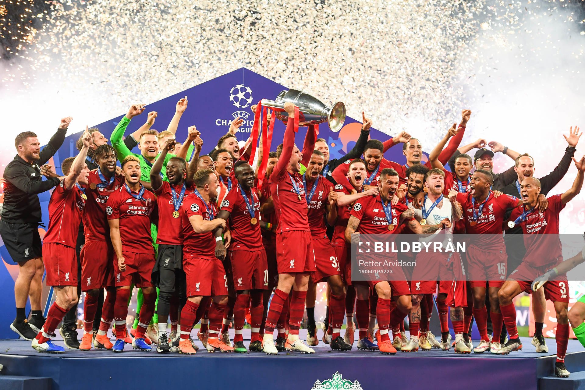 Players of Liverpool celebrate with the trophy