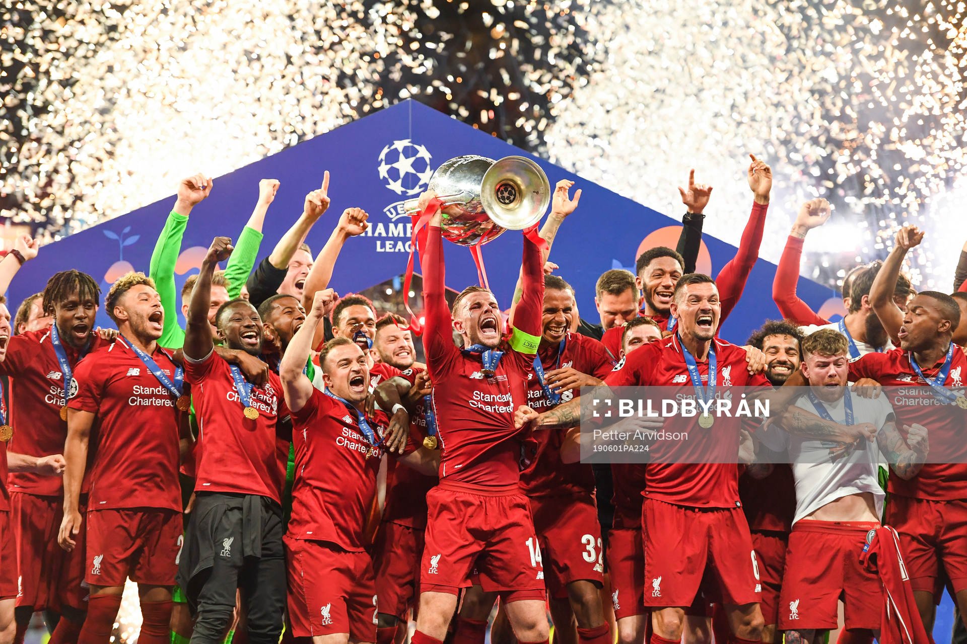 Jordan Henderson of Liverpool celebrate with the trophy