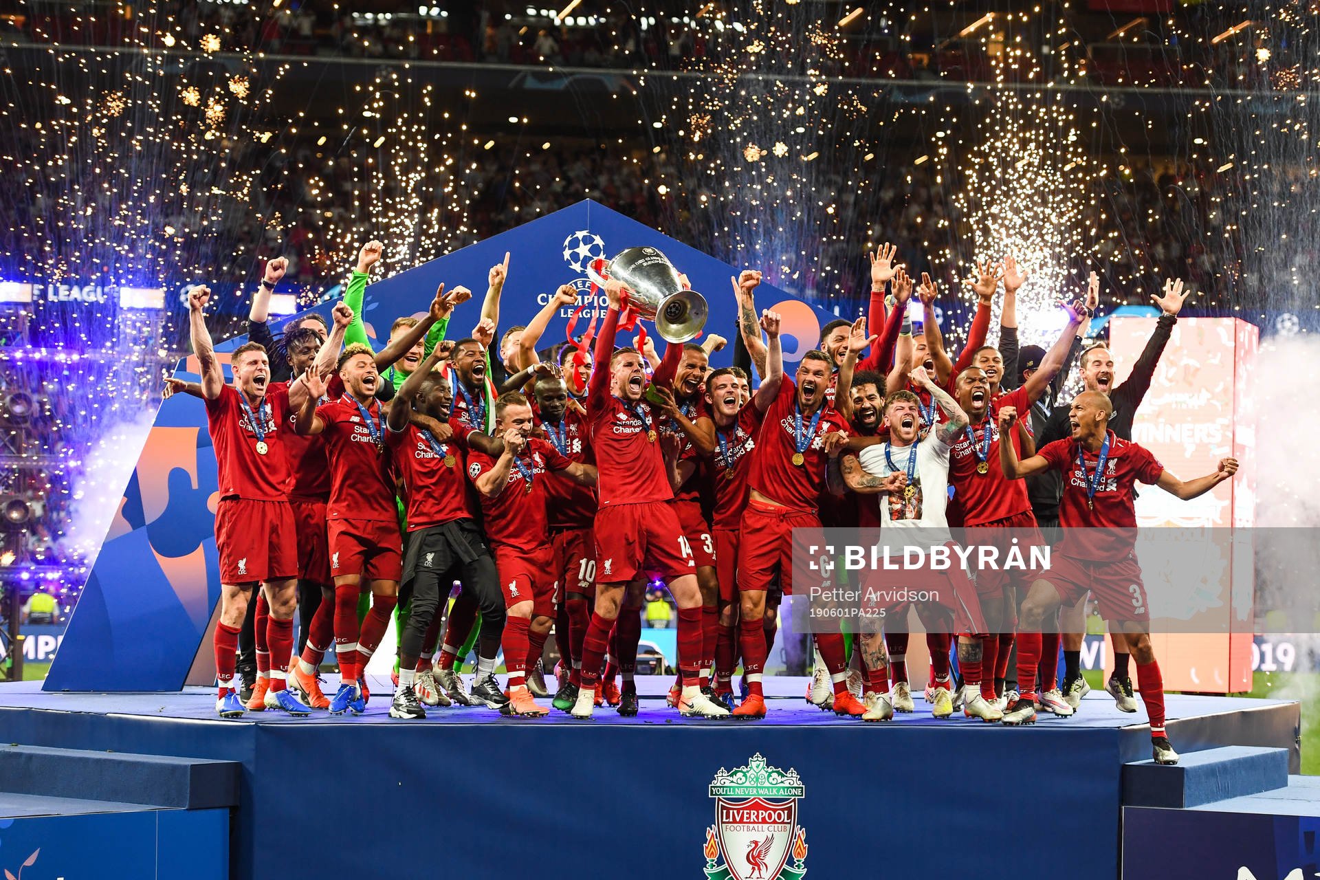 Jordan Henderson of Liverpool celebrate with the trophy