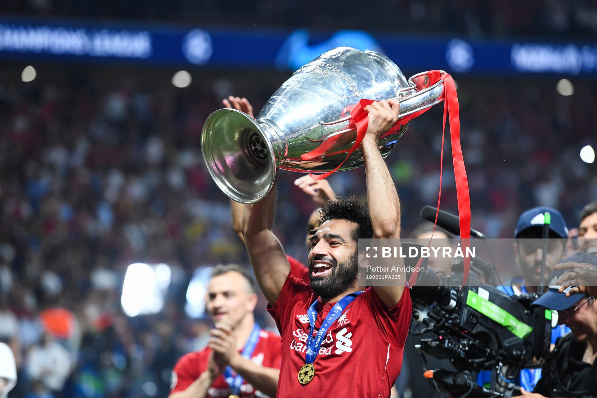 Mohamed Salah of Liverpool celebrates with the trophy