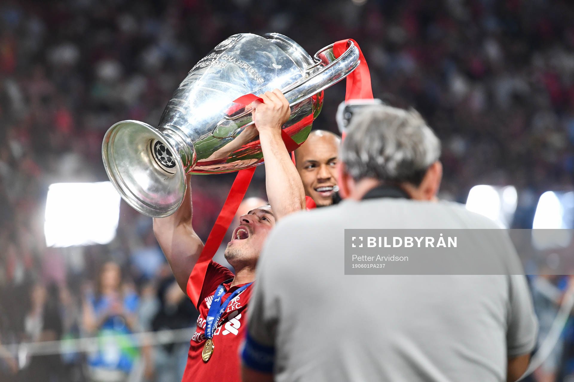 Xherdan Shaqiri of Liverpool celebrates with the trophy