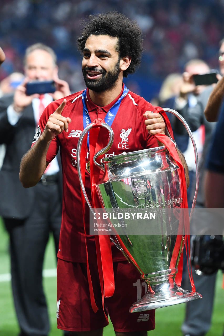 Mohamed Salah of Liverpool celebrates with the trophy