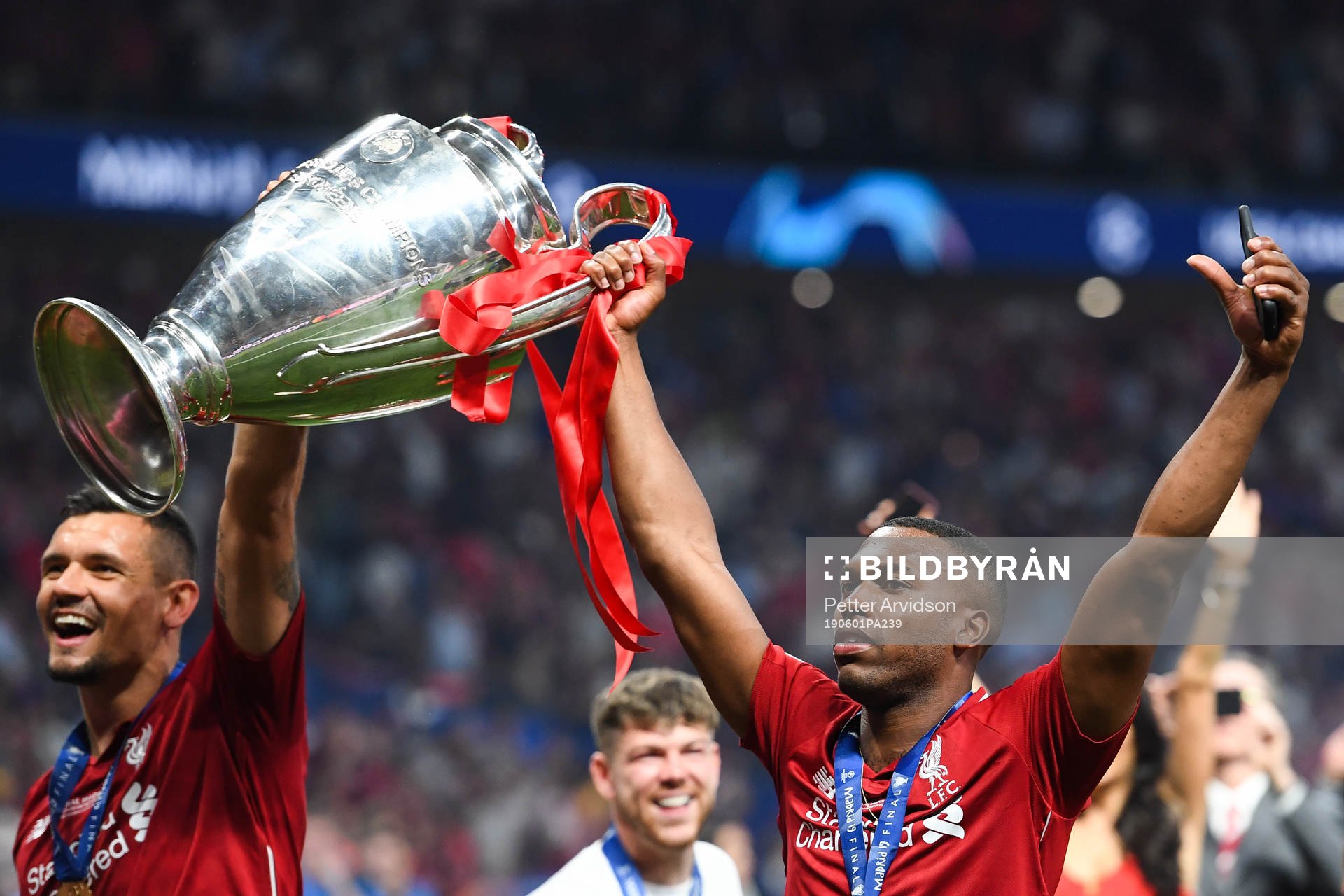 Daniel Sturridge of Liverpool celebrates with the trophy after the UEFA Champions League final between Tottenham and Liverpool on June 1, 2019 in Madrid.