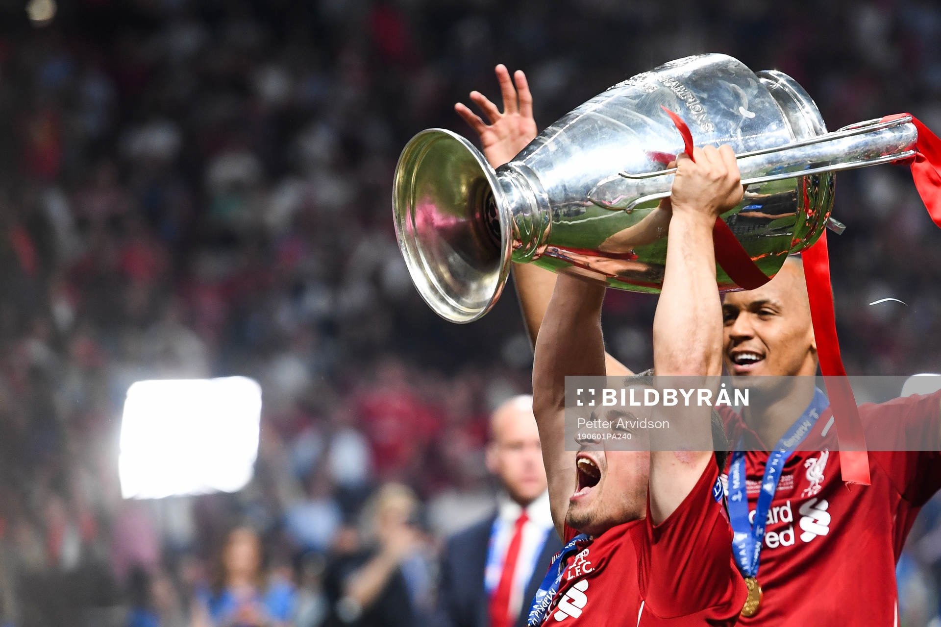 Xherdan Shaqiri of Liverpool celebrates with the trophy