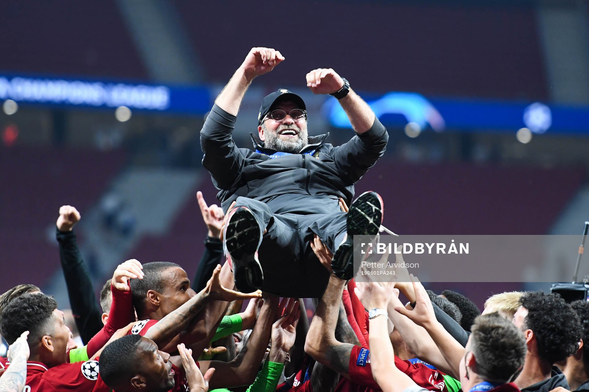 Head coach Jürgen Klopp of Liverpool is hoisted by the