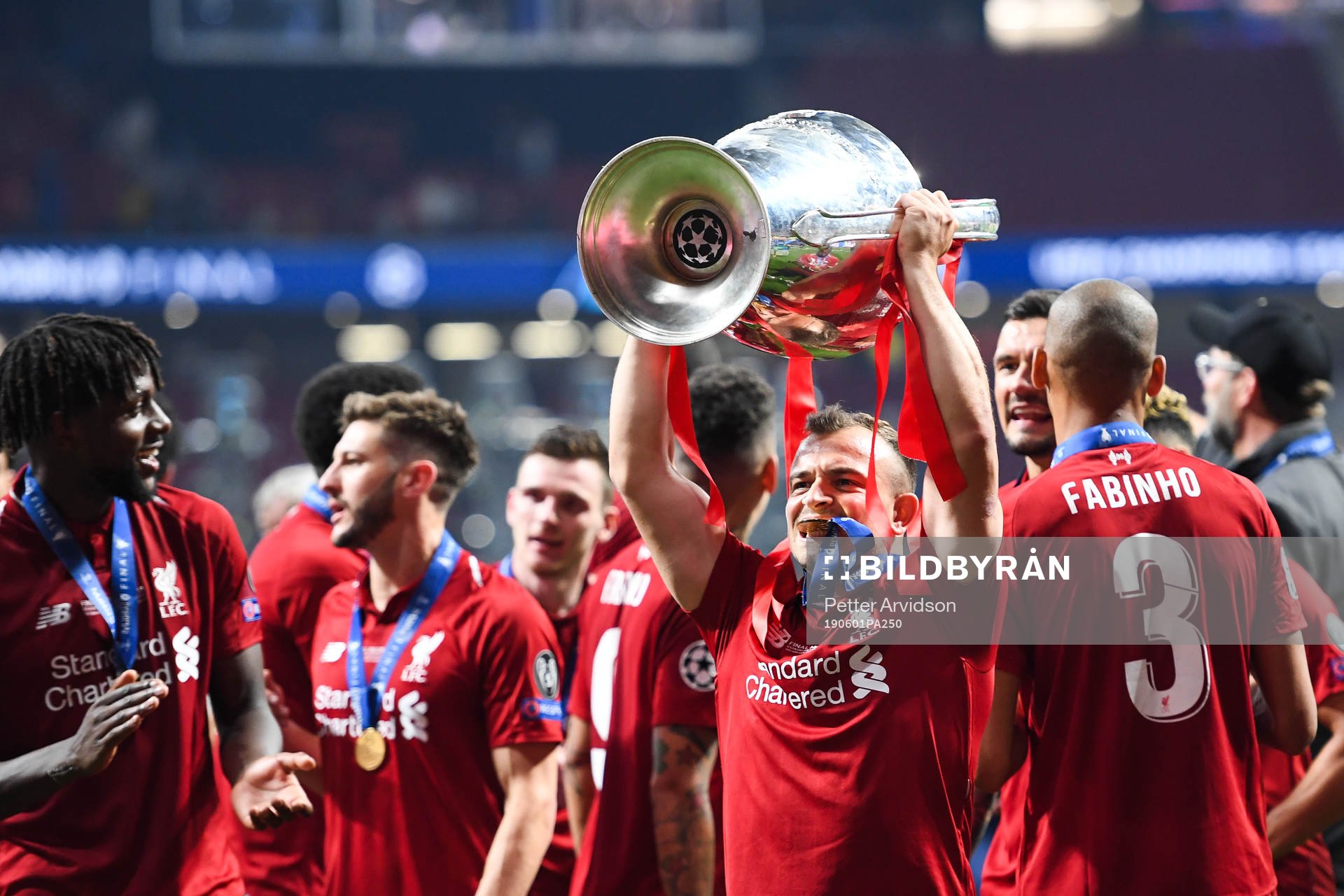 Xherdan Shaqiri of Liverpool celebrate with the trophy