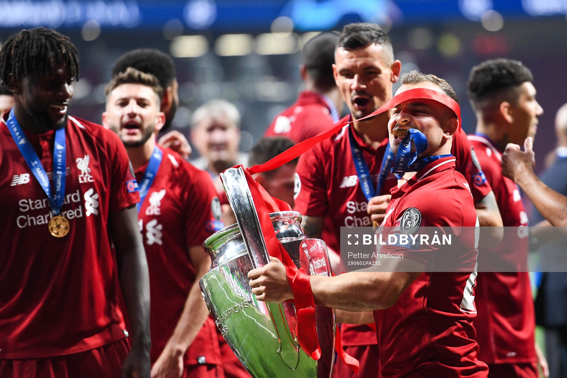 Xherdan Shaqiri of Liverpool celebrate with the trophy