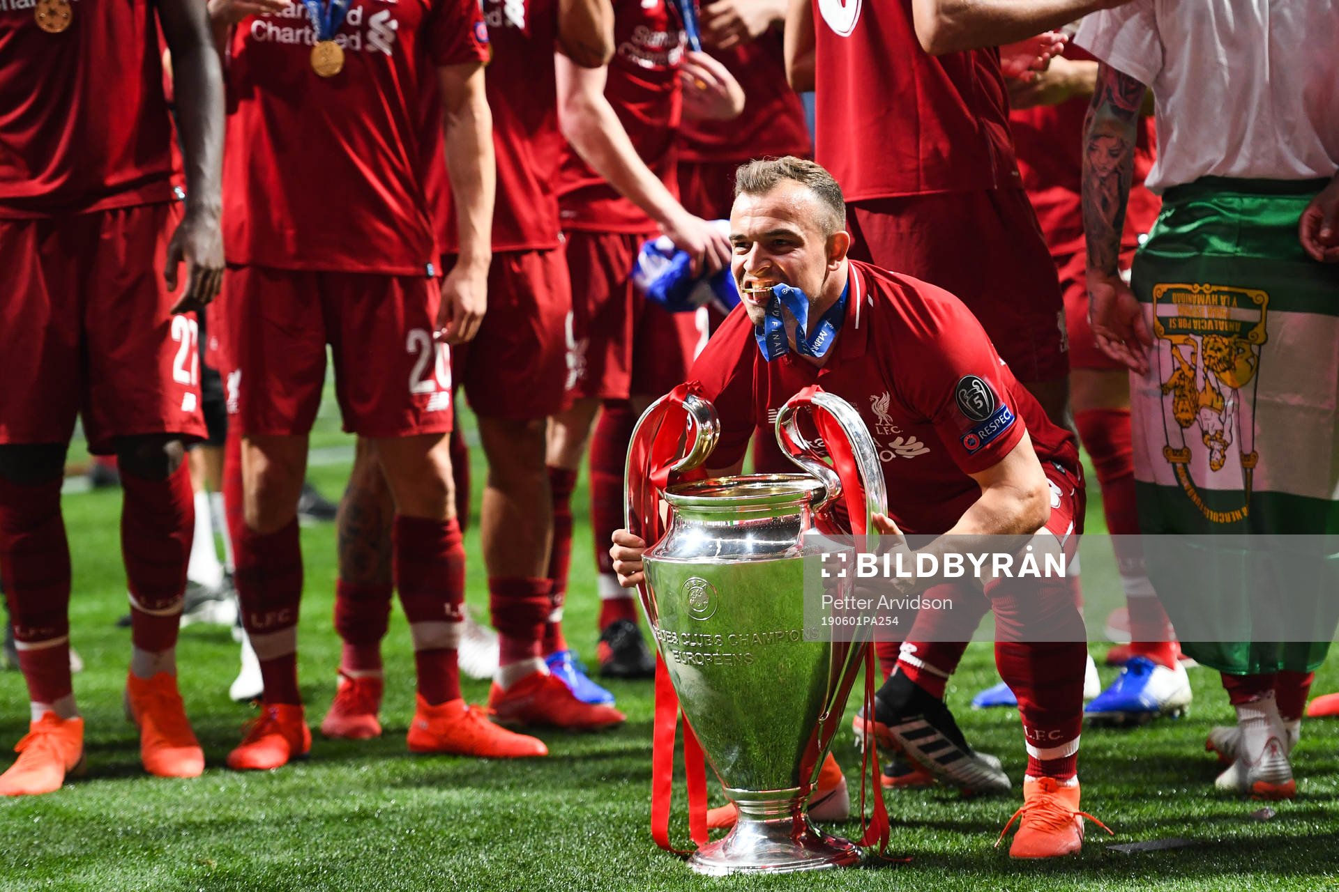 Xherdan Shaqiri of Liverpool celebrate with the trophy