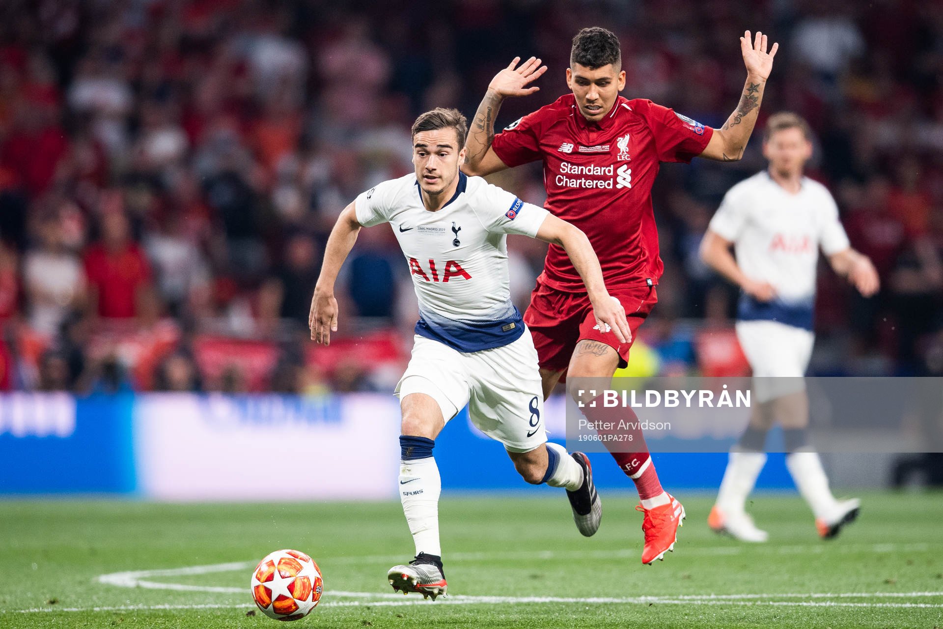Harry Winks of Tottenham and Roberto Firmino of Liverpool