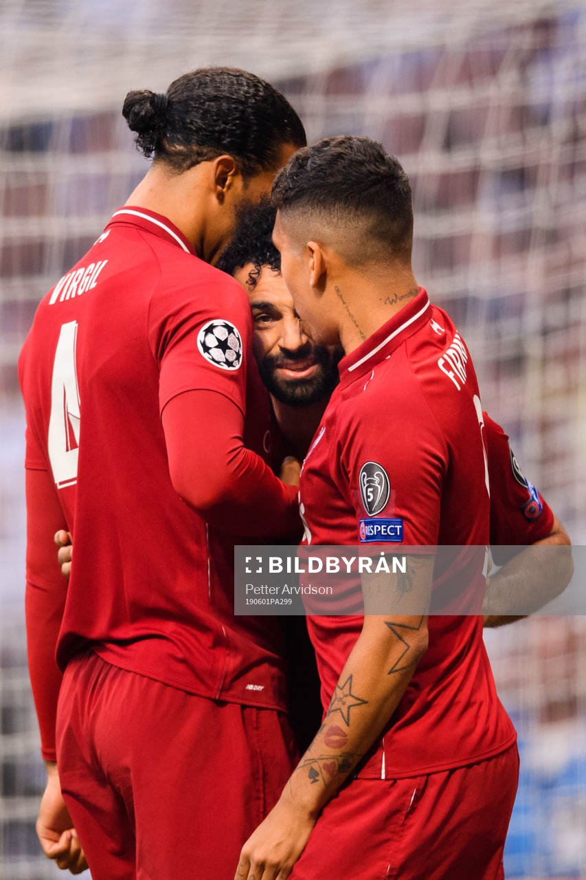 Mohamed Salah of Liverpool celebrates with Virgil van Dijk