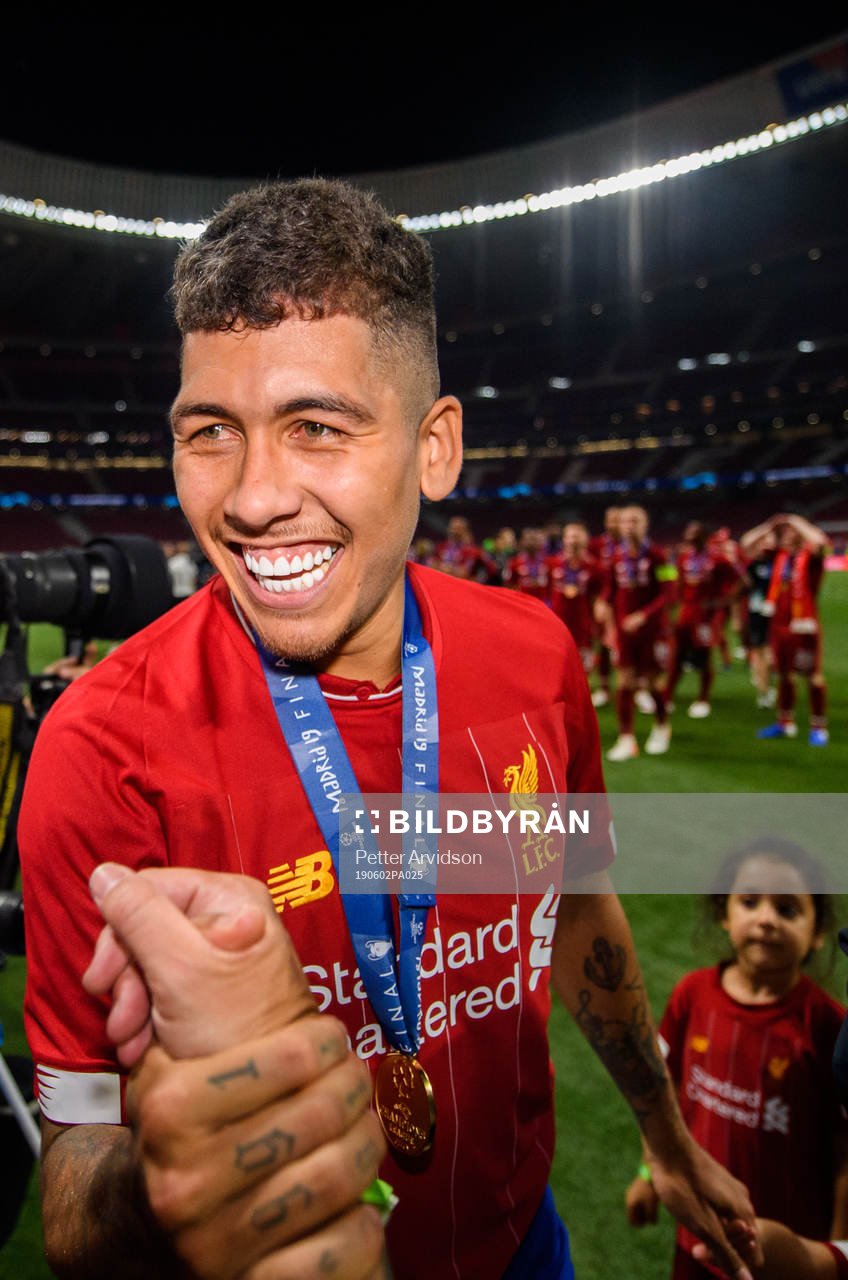 Roberto Firmino of Liverpool celebrating winning the UEFA