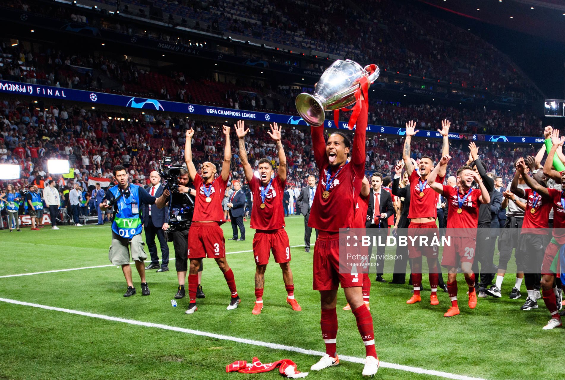 Virgil van Dijk of Liverpool celebrates with the throphy