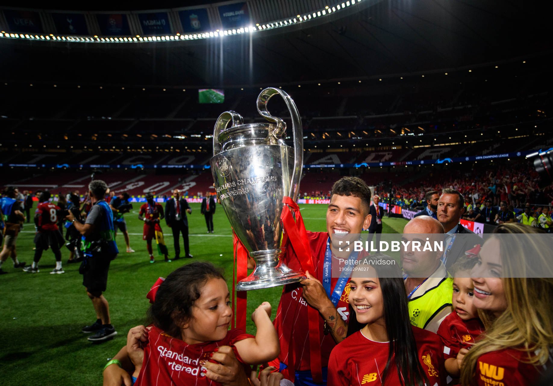 Roberto Firmino of Liverpool celebrates with the throphy