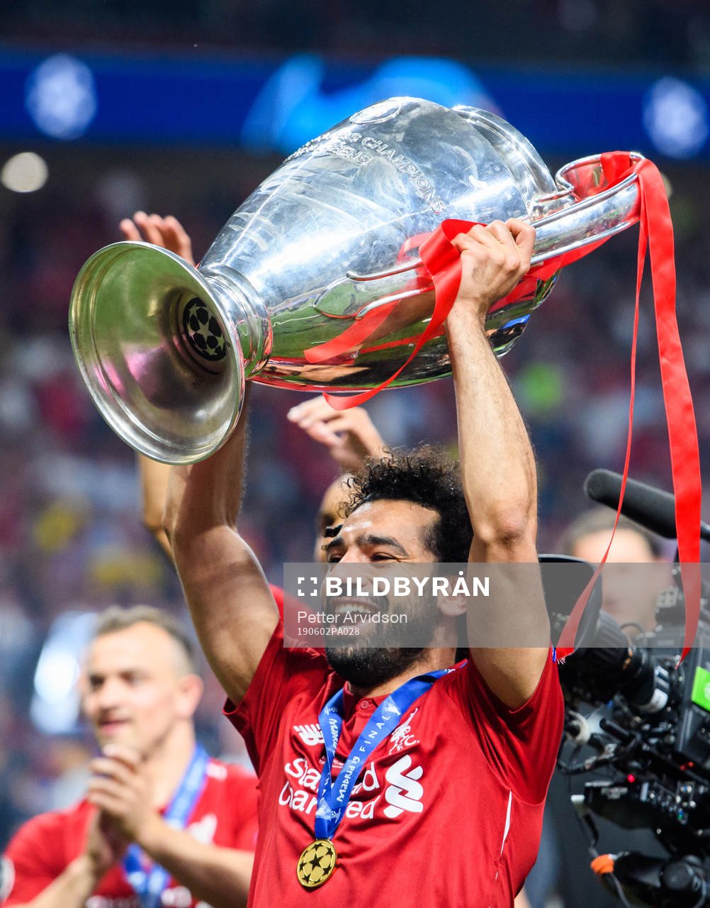 Mohamed Salah of Liverpool celebrates with the throphy