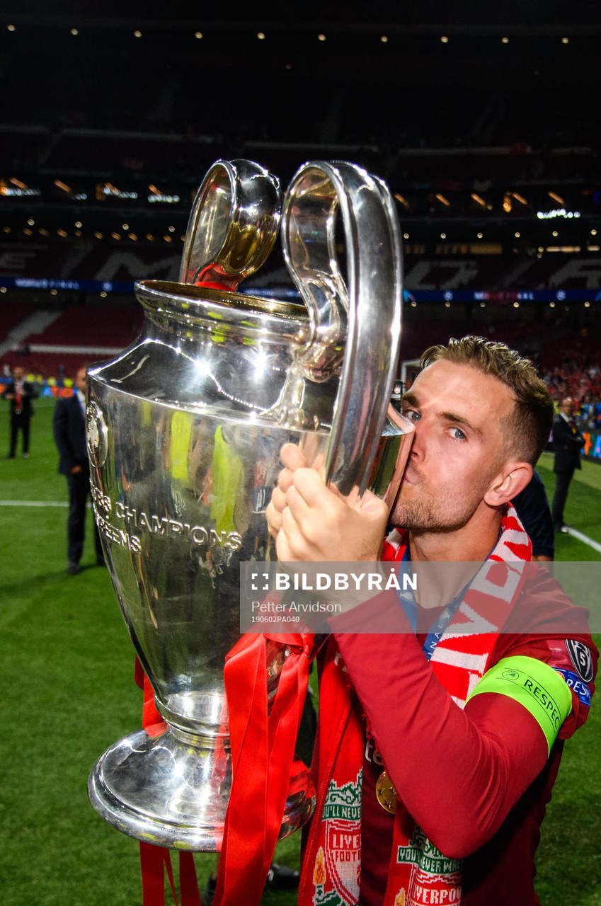 Jordan Henderson of Liverpool celebrates with the throphy