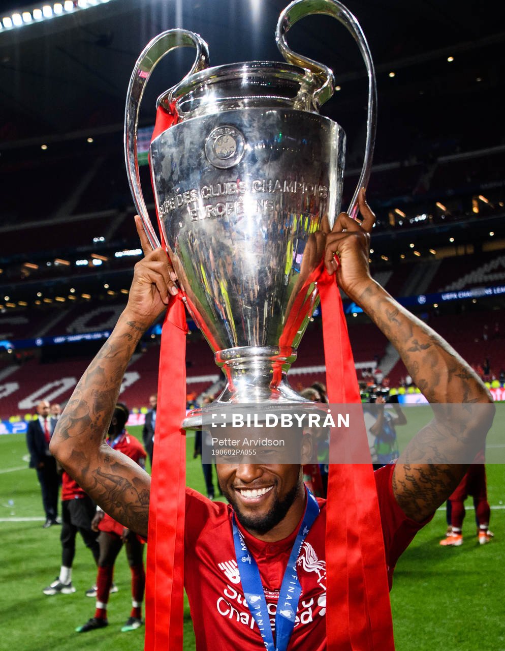 Georginio Wijnaldum of Liverpool celebrate with the trophy after the UEFA Champions League final between Tottenham and Liverpool on June 2, 2019 in Madrid.