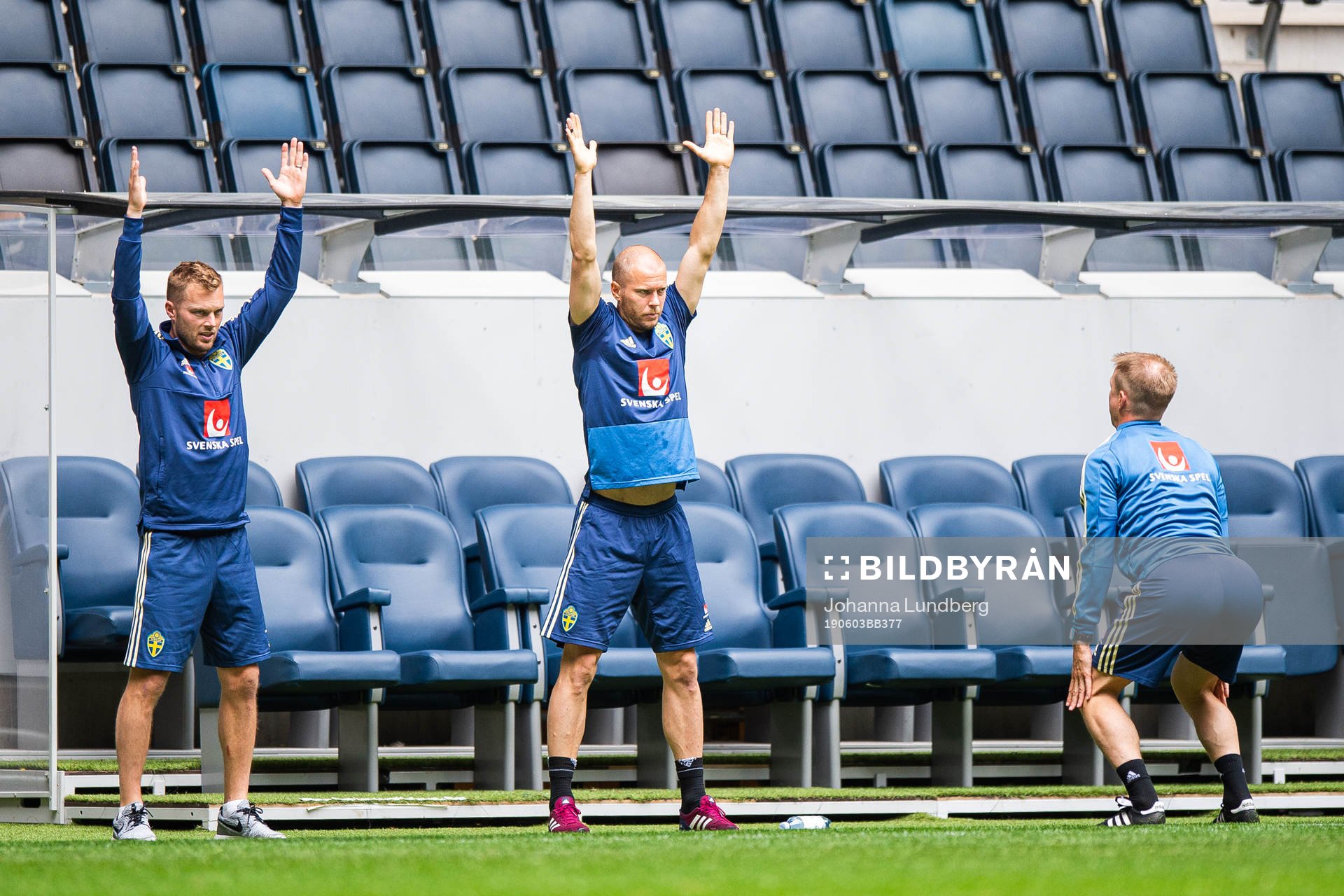 Sebastian Larsson and Per Karlsson follow instructions from