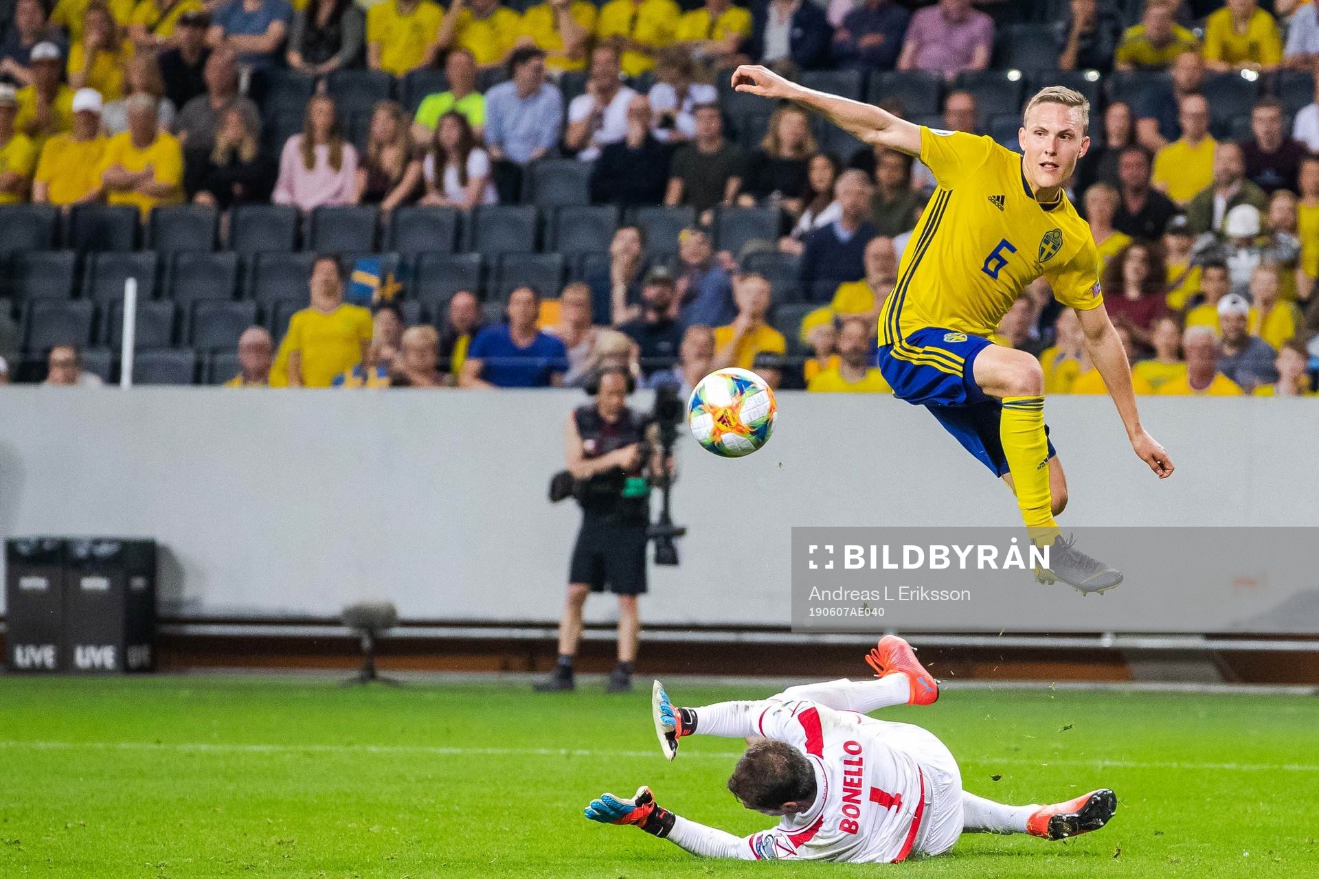 Ludwig Augustinsson of Sweden and goalkeeper Henry Bonello