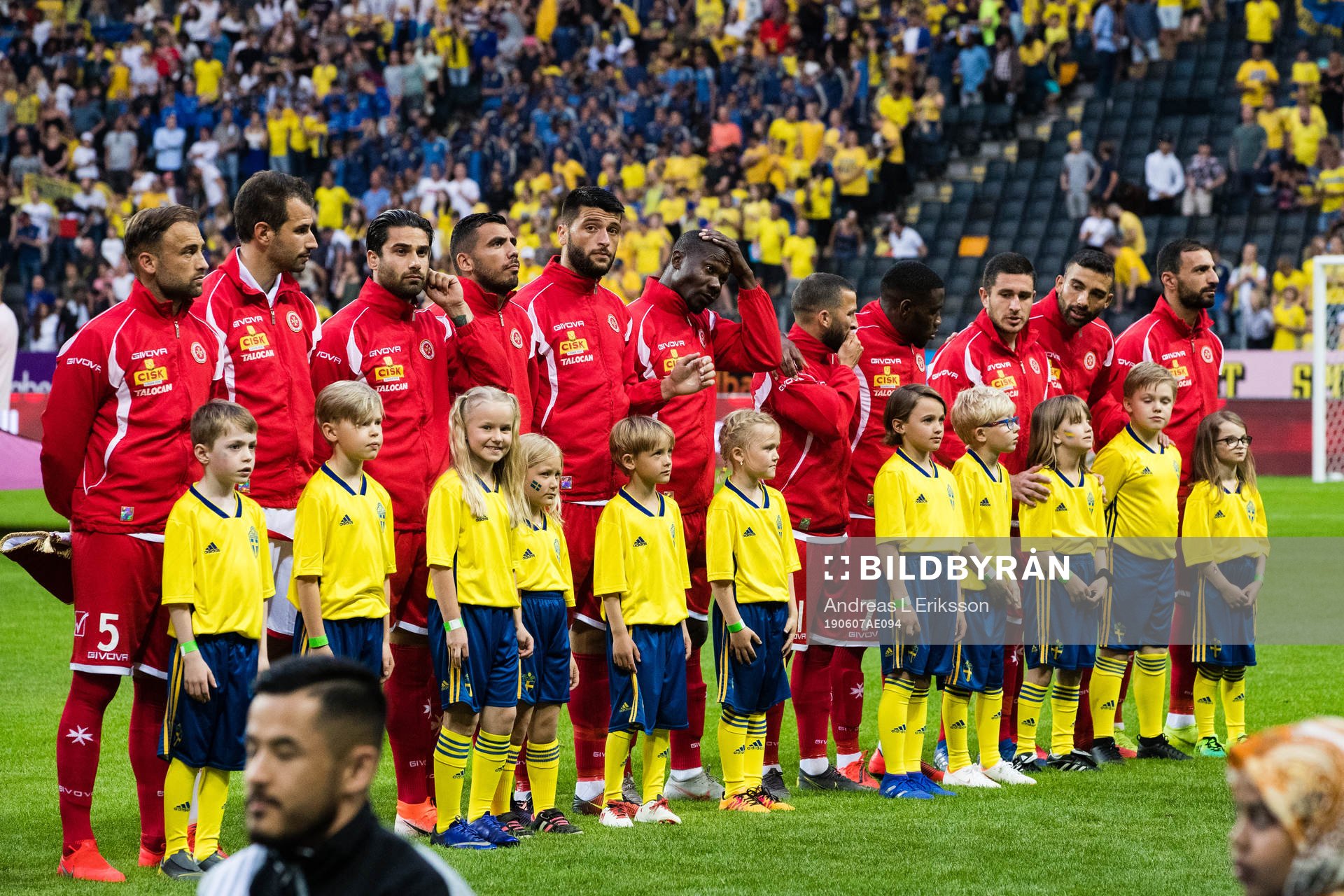 Players of Malta with mascots