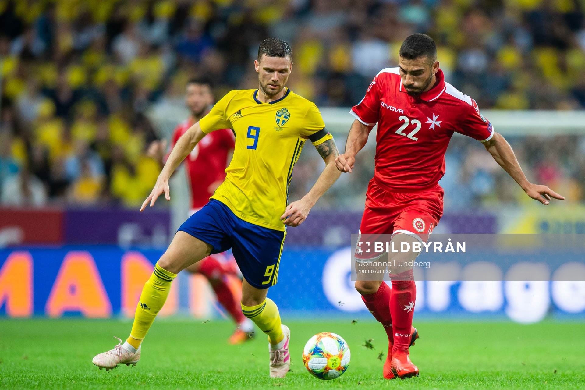 Marcus Berg of Sweden and Alfred Effiong of Malta