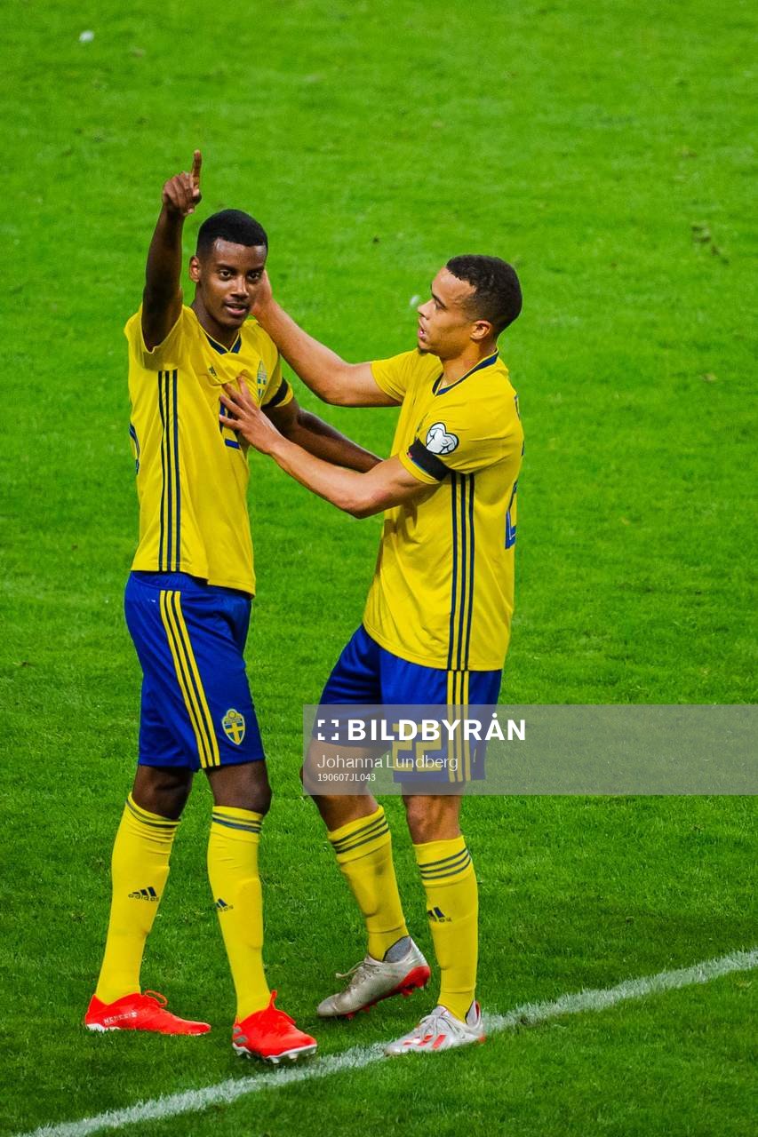 Alexander Isak and Robin Quaison of Sweden celebrate