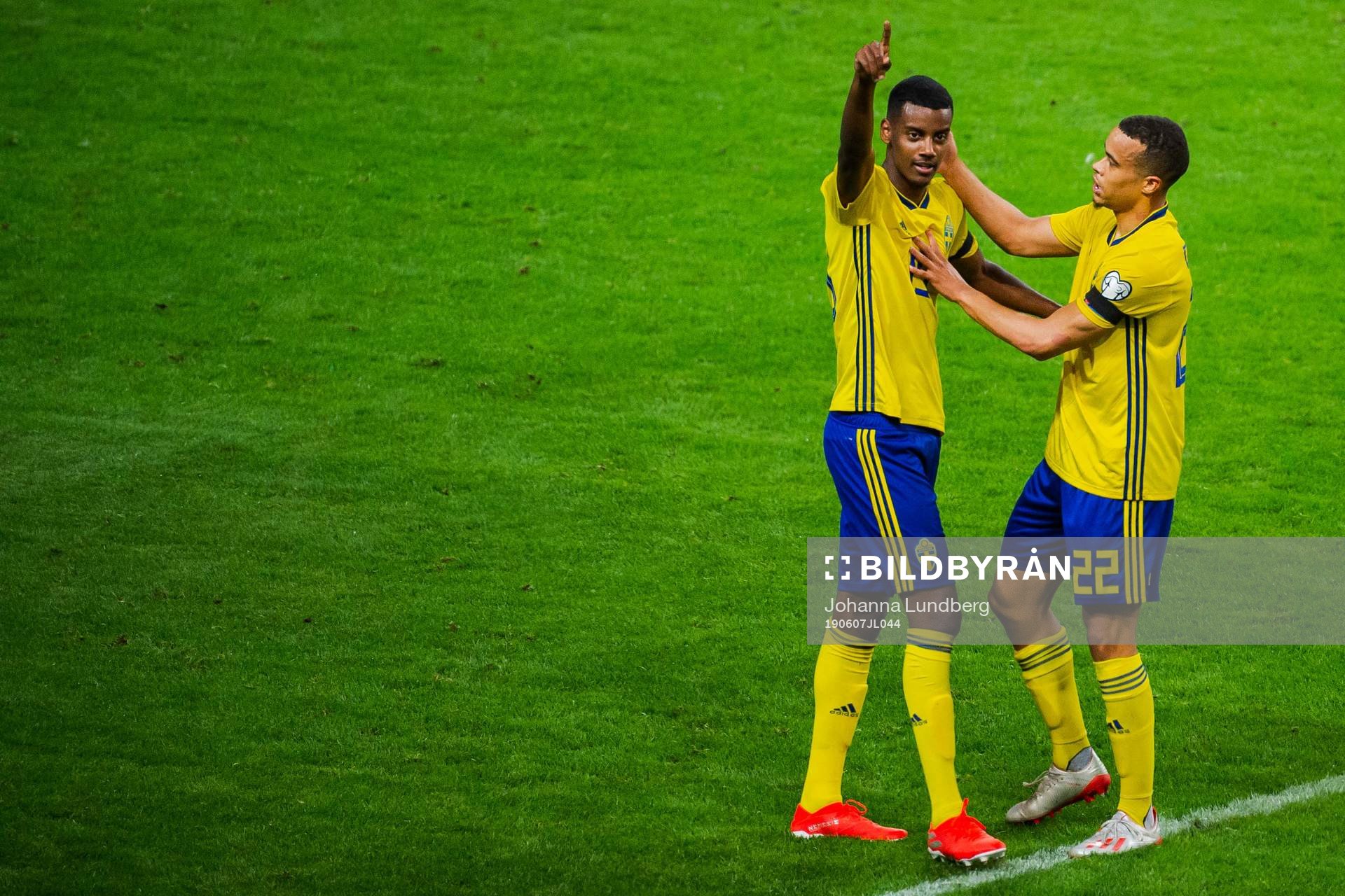 Alexander Isak and Robin Quaison of Sweden celebrate